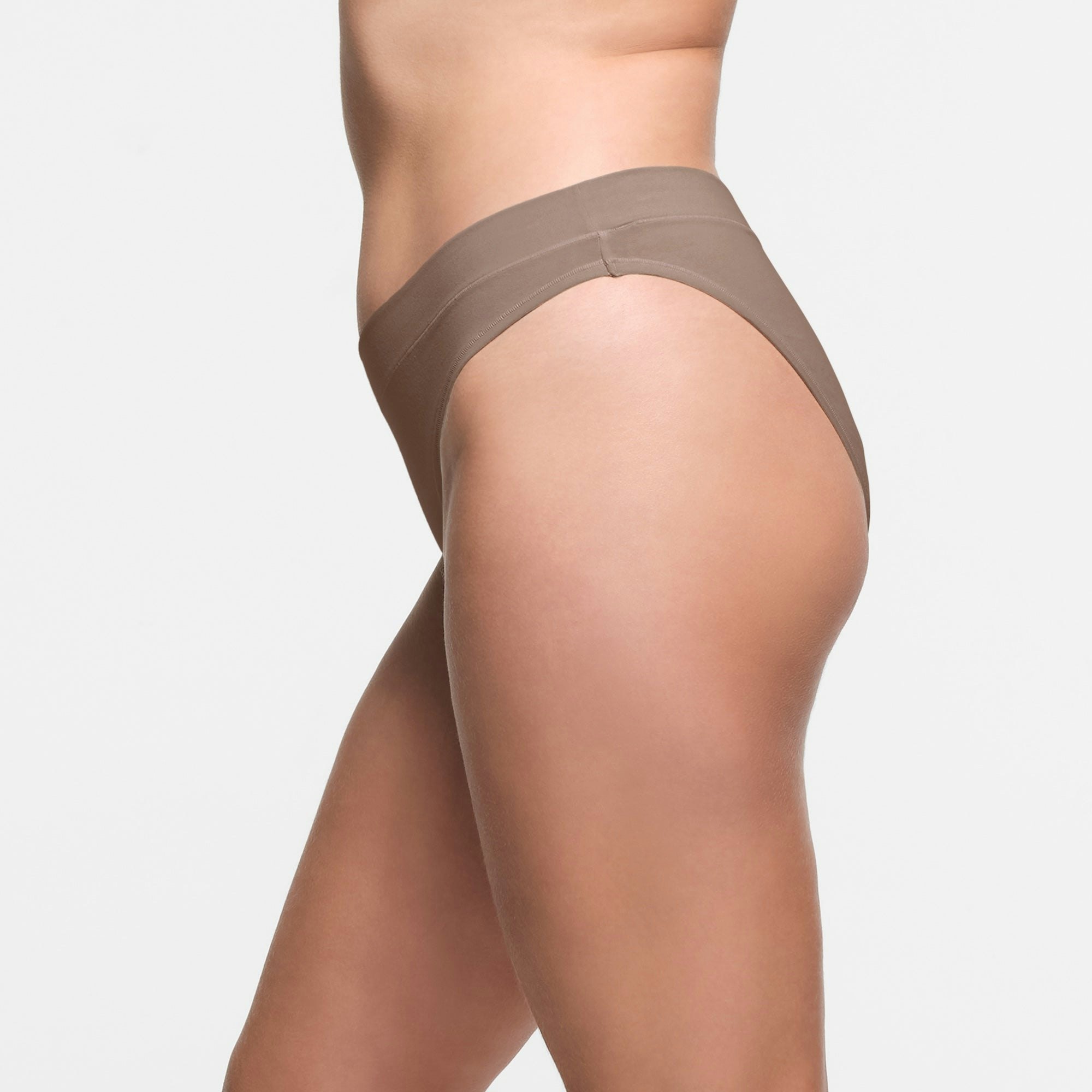 COTTON JERSEY CHEEKY TANGA | TRUFFLE ON A MODEL SIDE VIEW