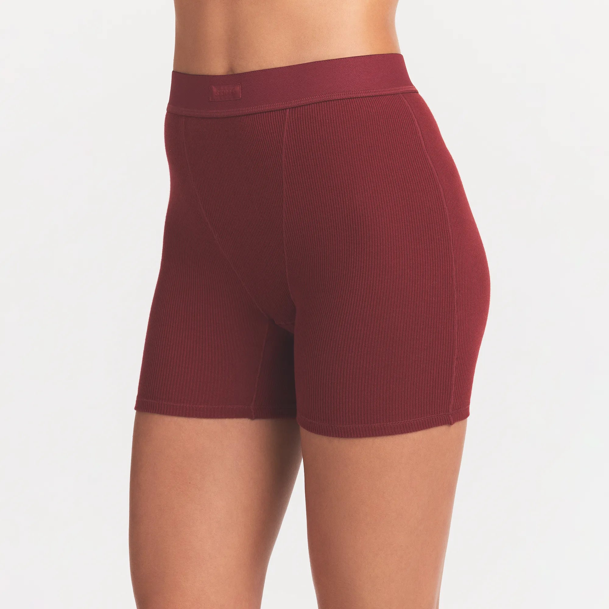 COTTON RIB BOXER | MERLOT ON A MODEL SIDE VIEW @ | FOCUS: 0.0, 1.0, 0.9