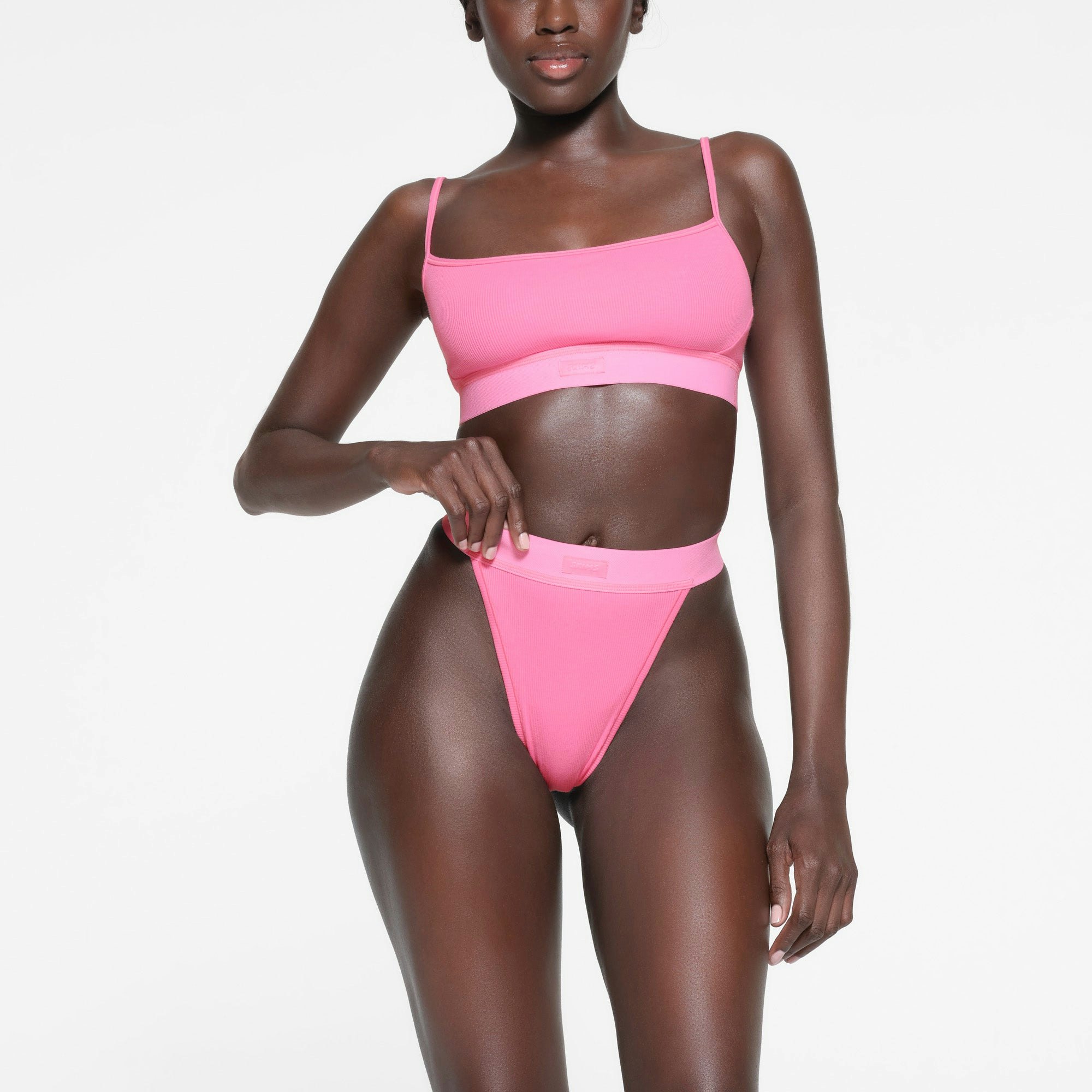 COTTON RIB THONG | SUGAR PINK ON A MODEL FRONT VIEW