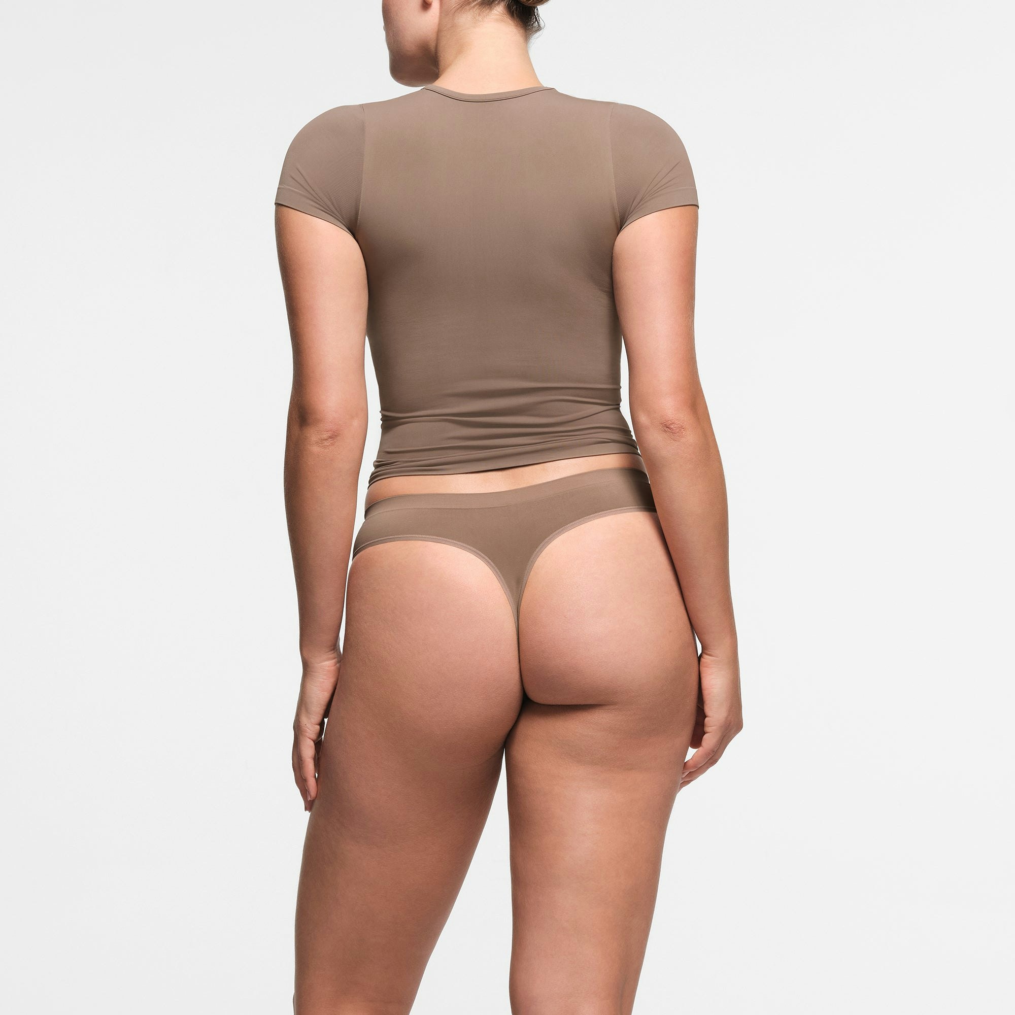 SOFT SMOOTHING SEAMLESS THONG | TRUFFLE ON A MODEL BACK VIEW
