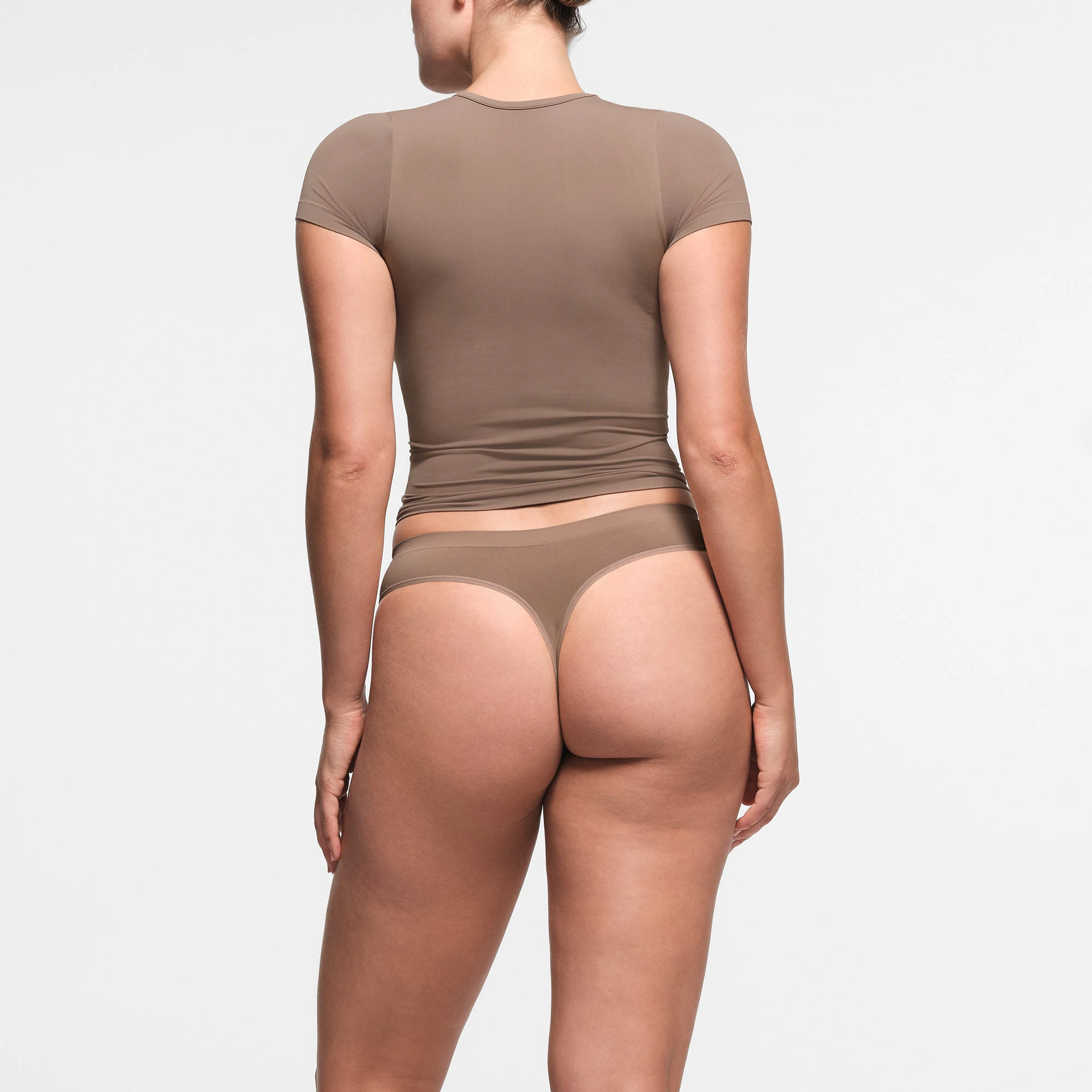 SOFT SMOOTHING SEAMLESS THONG | TRUFFLE ON A MODEL BACK VIEW