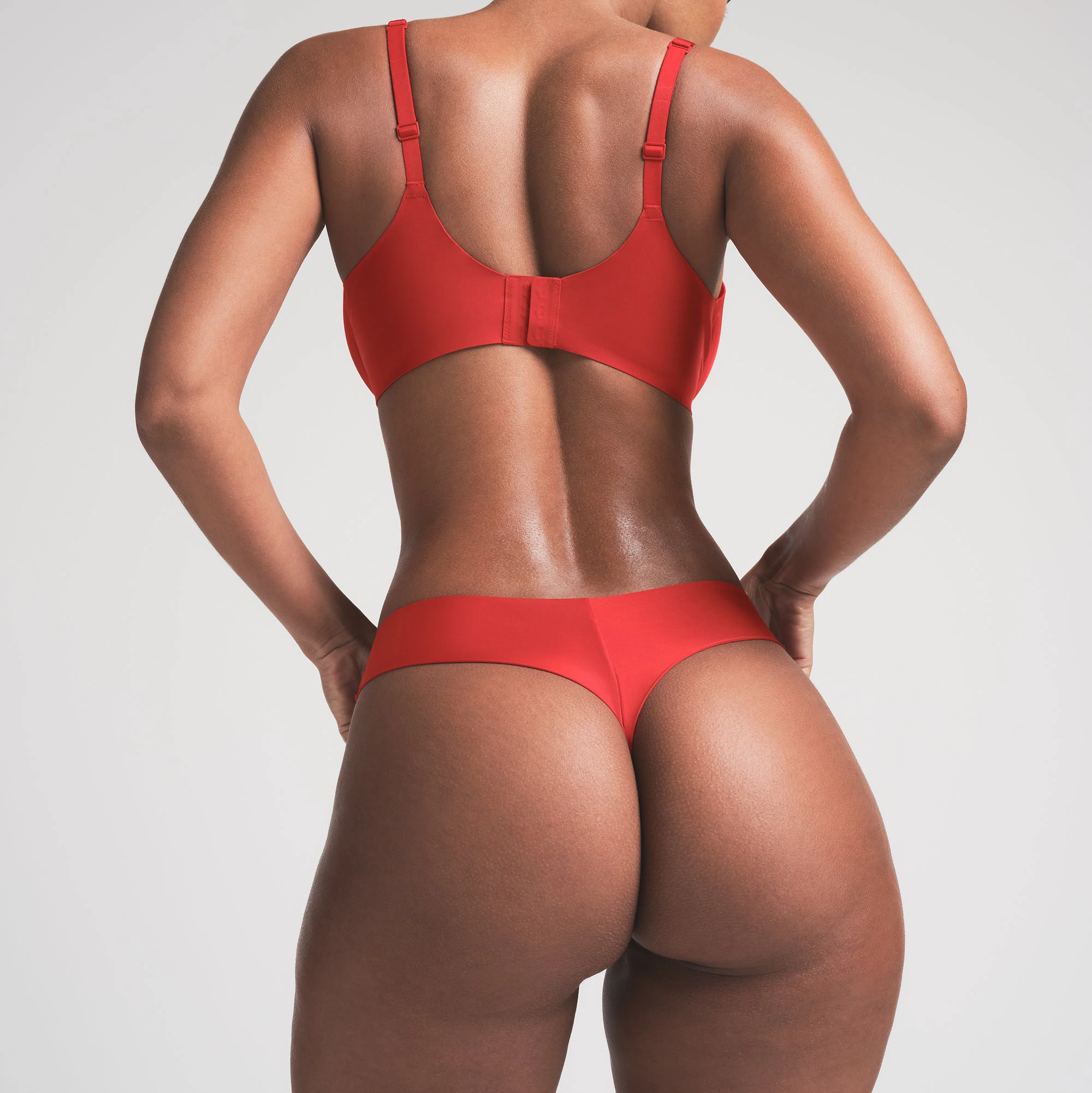 SHINE FOUNDATIONS THONG | CAYENNE ON A MODEL BACK VIEW | FOCUS: 0.0, 1.0, 0.9
