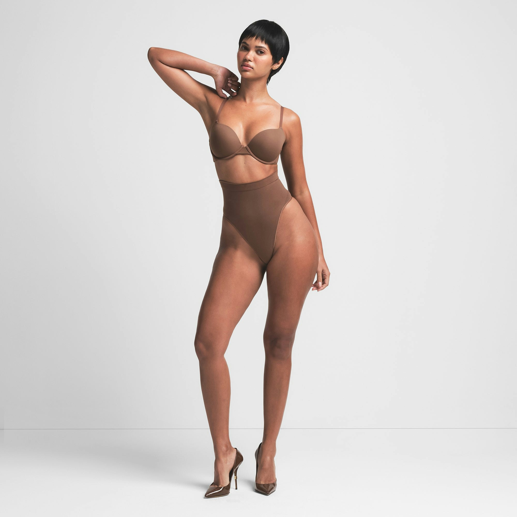 SEAMLESS SCULPT MID WAIST THONG | JASPER ON A MODEL FRONT VIEW | FOCUS: 0.0, 1.0, 0.9