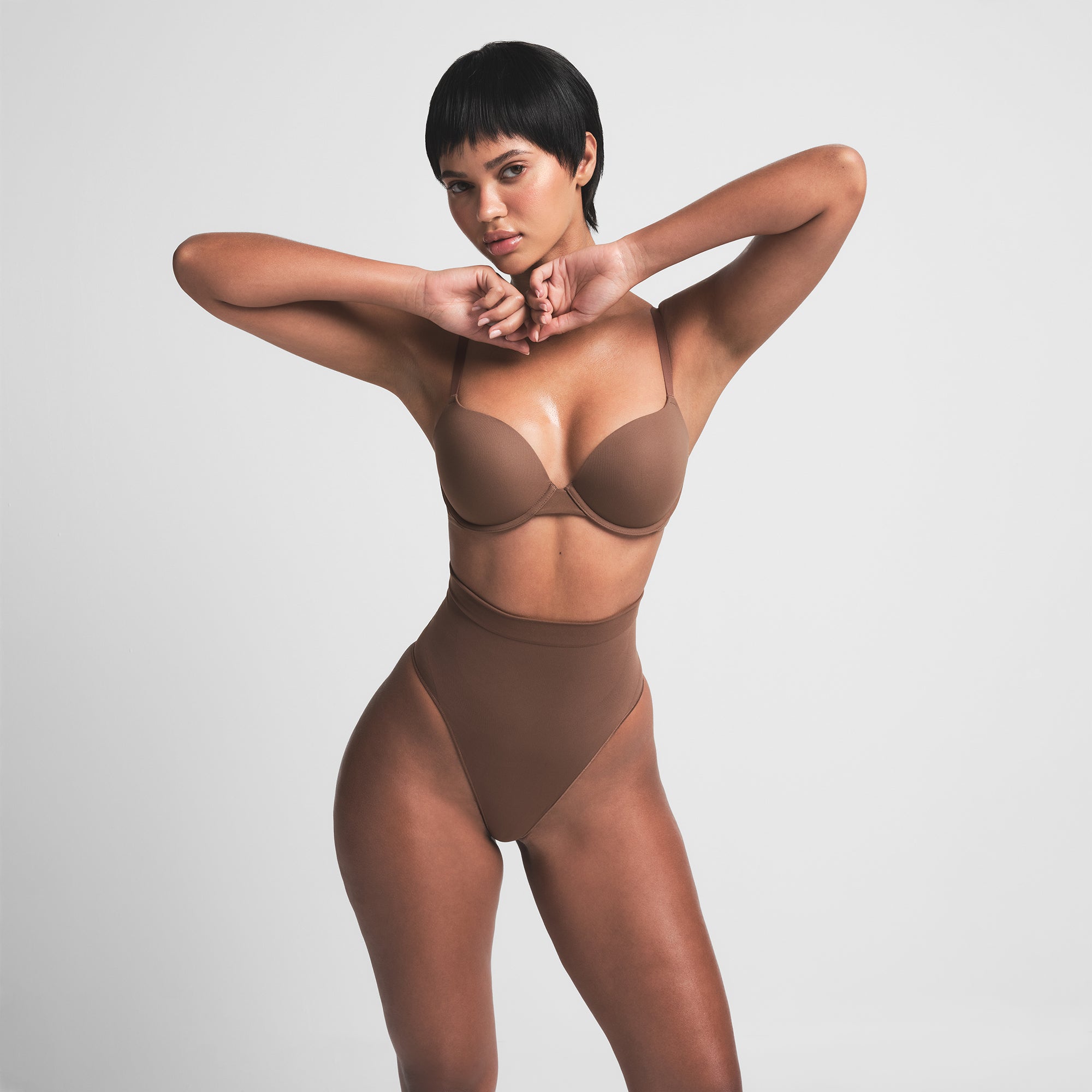 SEAMLESS SCULPT MID WAIST THONG | JASPER ON A MODEL FRONT VIEW | FOCUS: 0.0, 1.0, 0.9