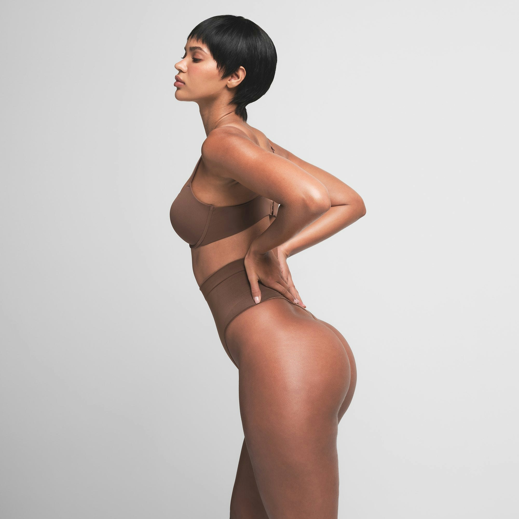 SEAMLESS SCULPT MID WAIST THONG | JASPER ON A MODEL SIDE VIEW | FOCUS: 0.0, 1.0, 0.9