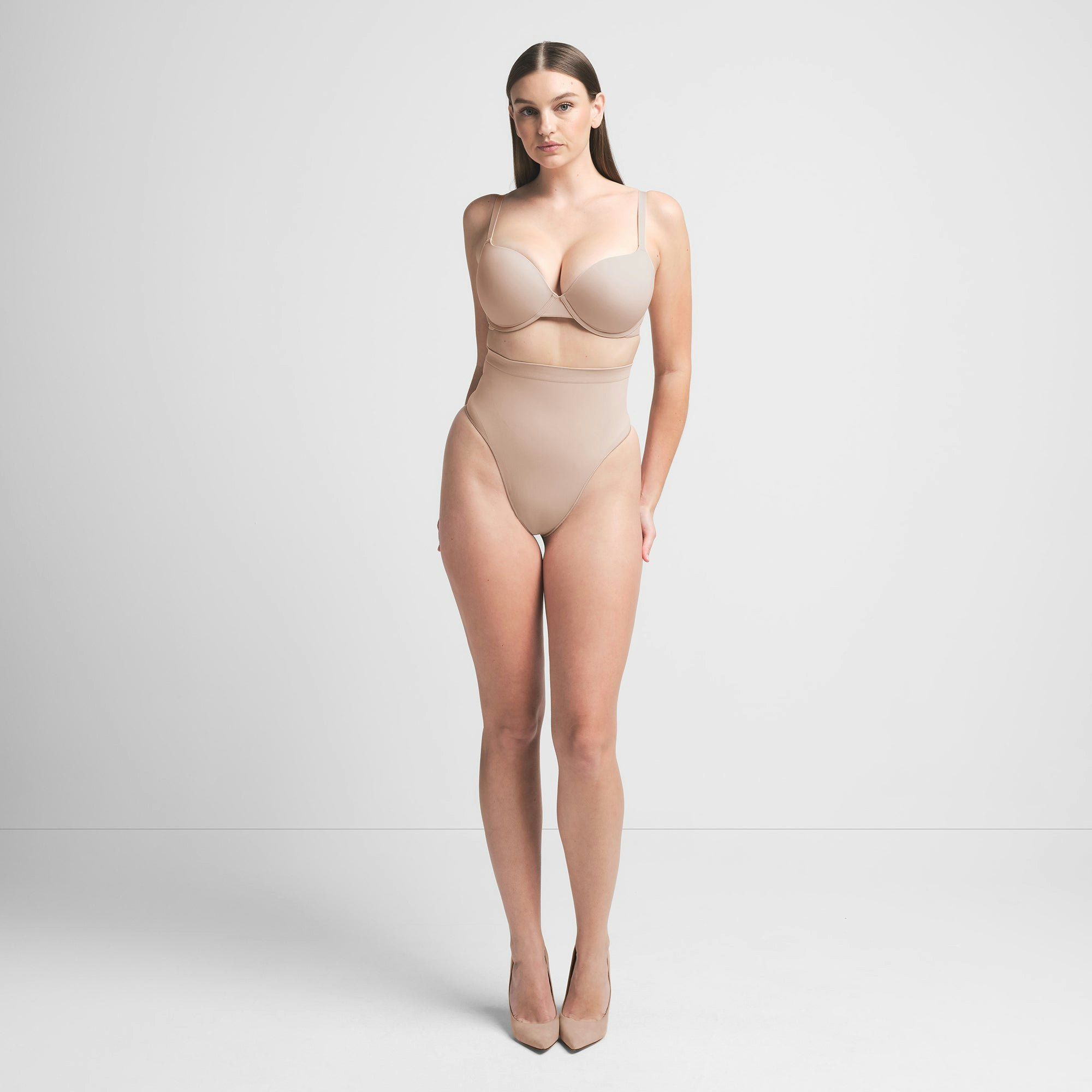 SEAMLESS SCULPT MID WAIST THONG | MICA ON A MODEL FRONT VIEW | FOCUS: 0.0, 1.0, 0.9