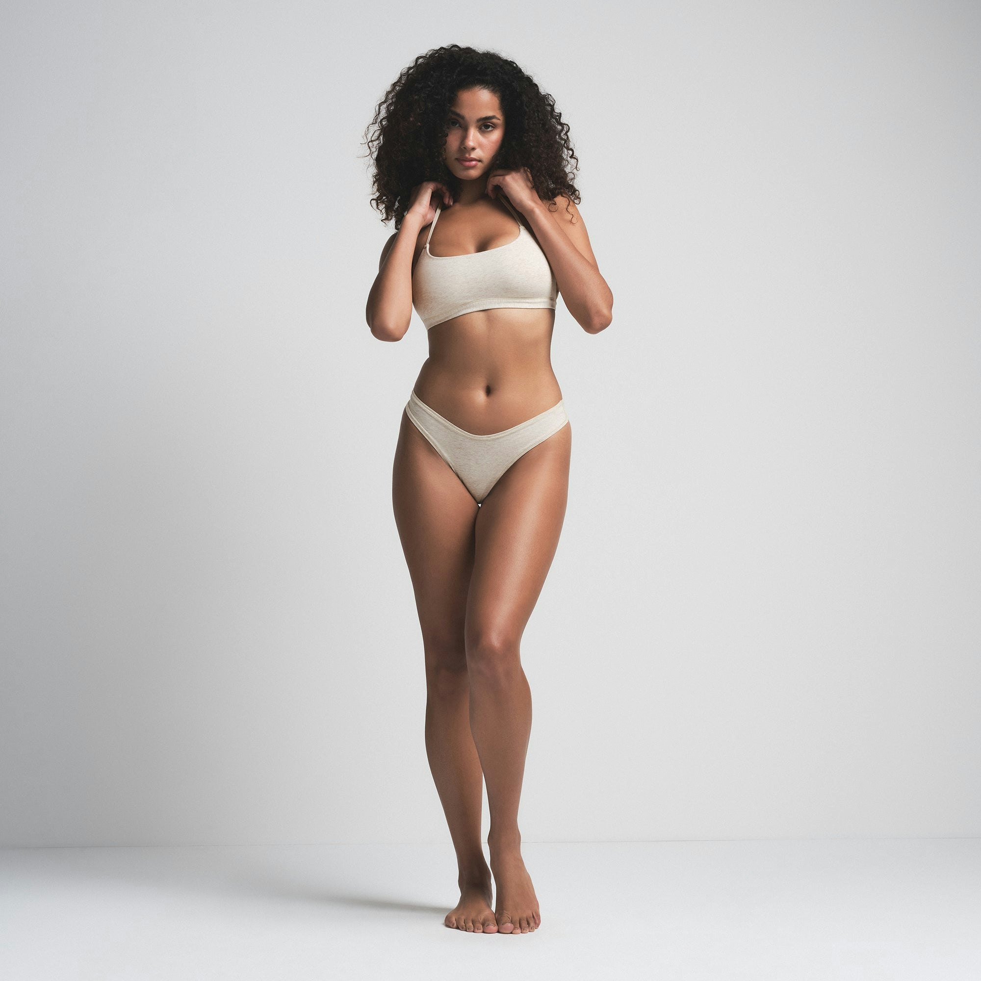 COTTON JERSEY DIPPED THONG 5-PACK | OATMEAL MULTI ON A MODEL FRONT VIEW