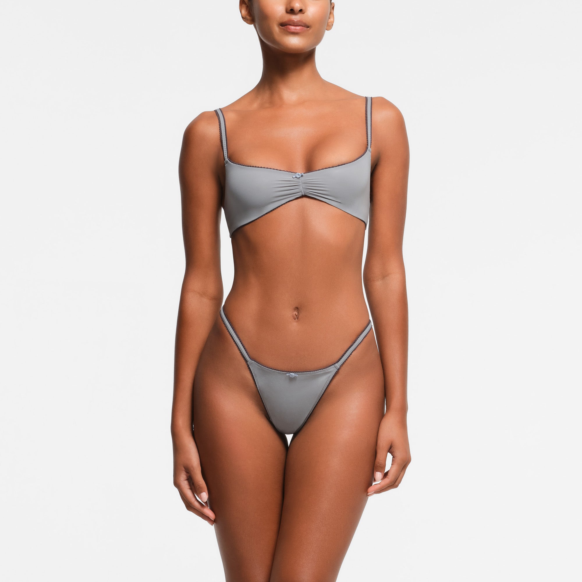 FITS EVERYBODY PICOT TRIM STRING THONG | PACIFIC ON A MODEL FRONT VIEW