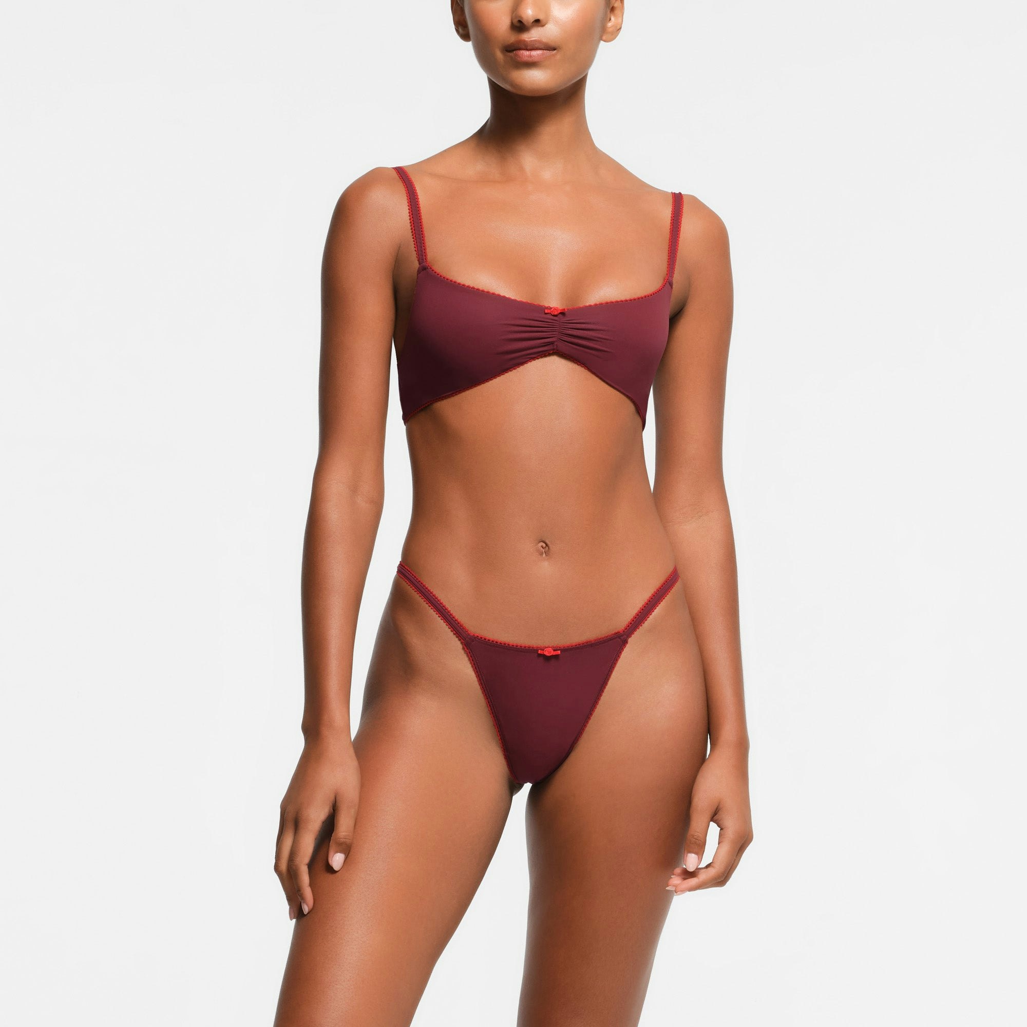 FITS EVERYBODY PICOT TRIM STRING THONG | WINE CONTRAST ON A MODEL FRONT VIEW