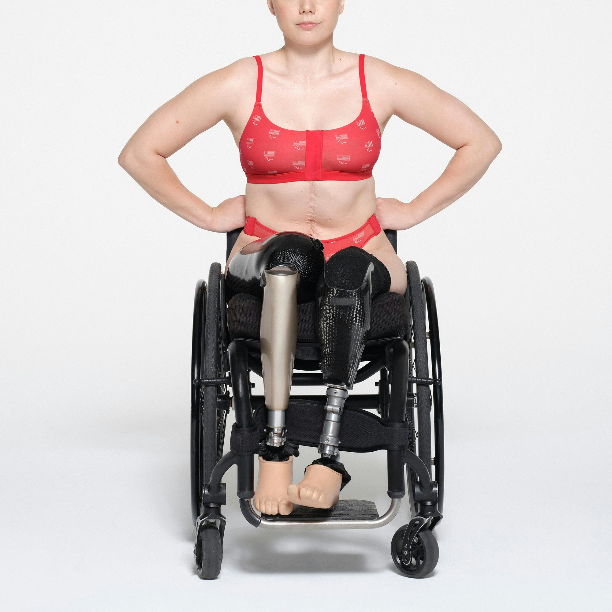 SKIMS FOR TEAM USA FITS EVERYBODY ADAPTIVE PARALYMPIC THONG | RED ON A MODEL FRONT VIEW | FOCUS: 0.1, 1, 0.9