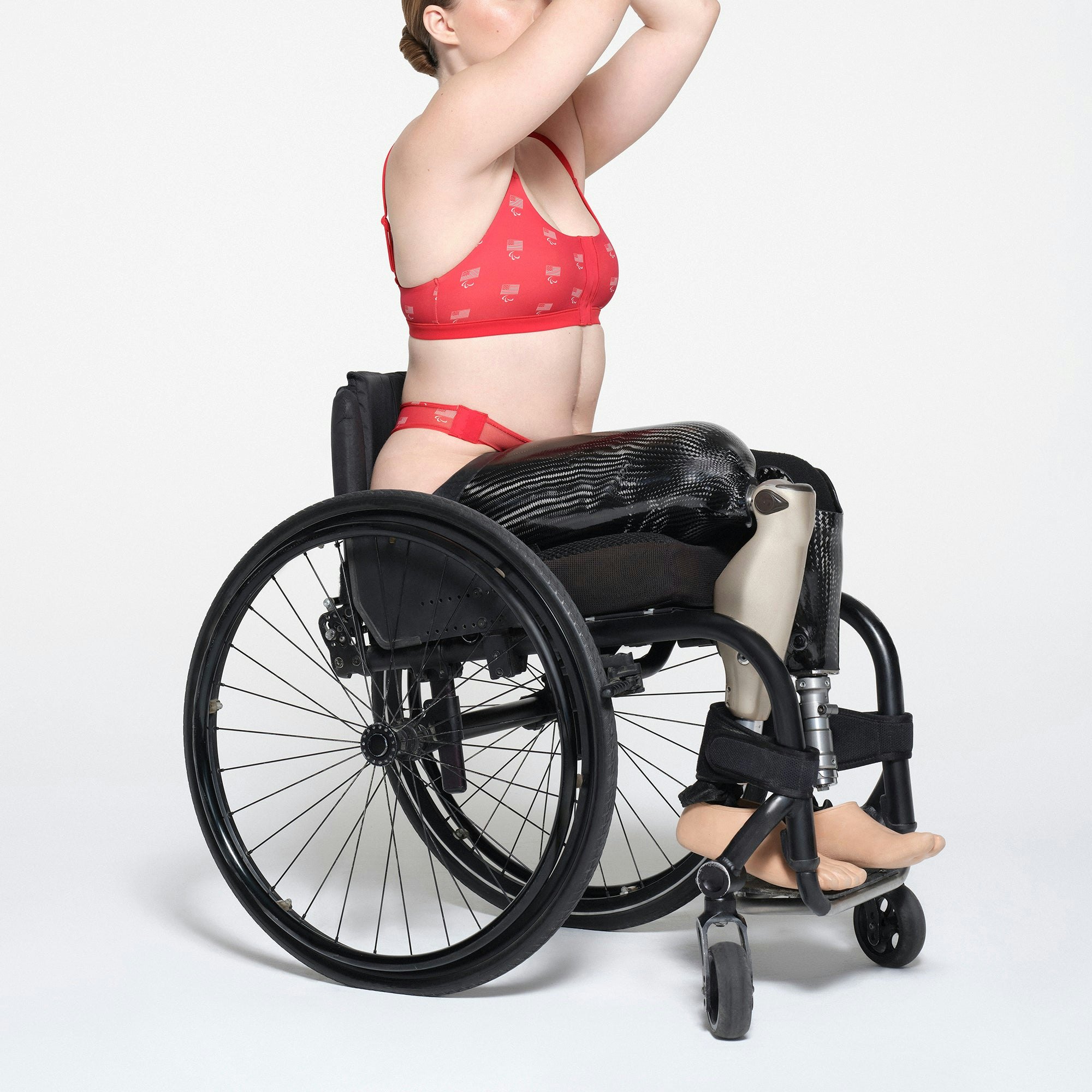 SKIMS FOR TEAM USA FITS EVERYBODY ADAPTIVE PARALYMPIC THONG | RED ON A MODEL SIDE VIEW