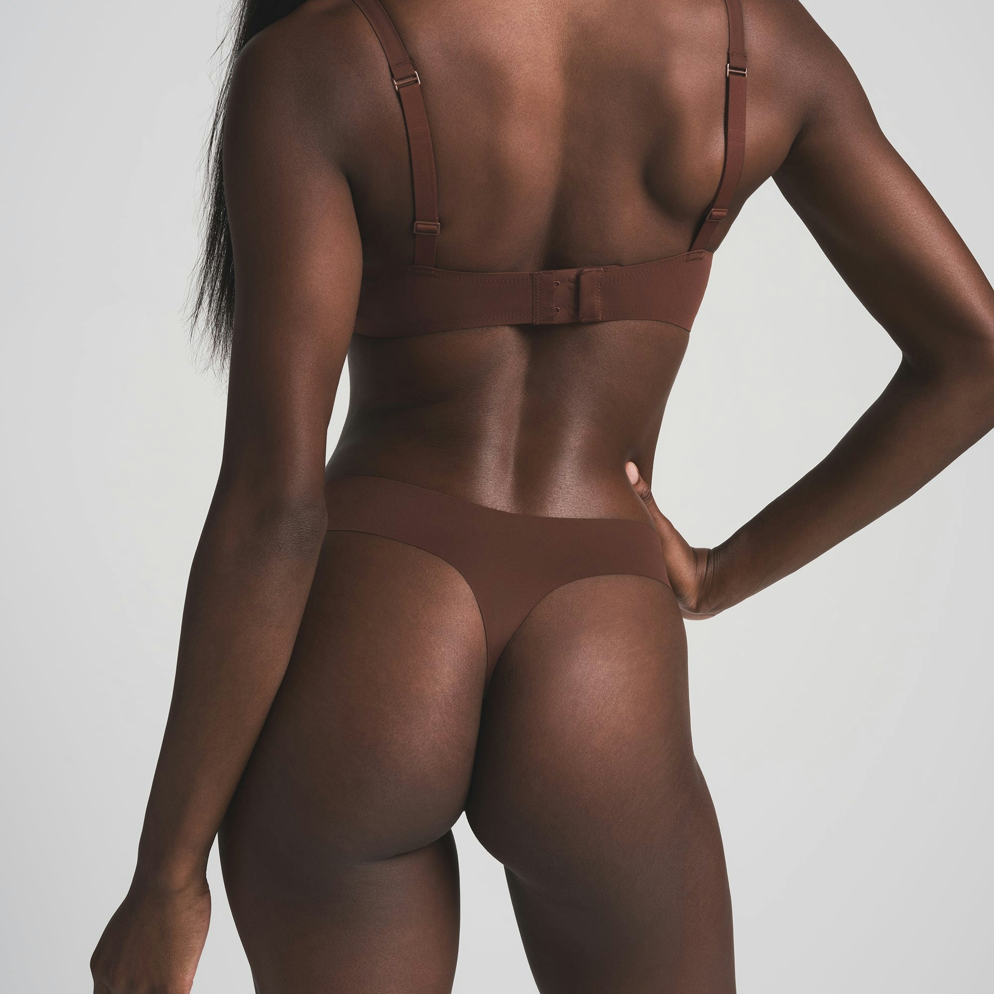 NAKED DIPPED THONG | COCOA ON A MODEL BACK VIEW