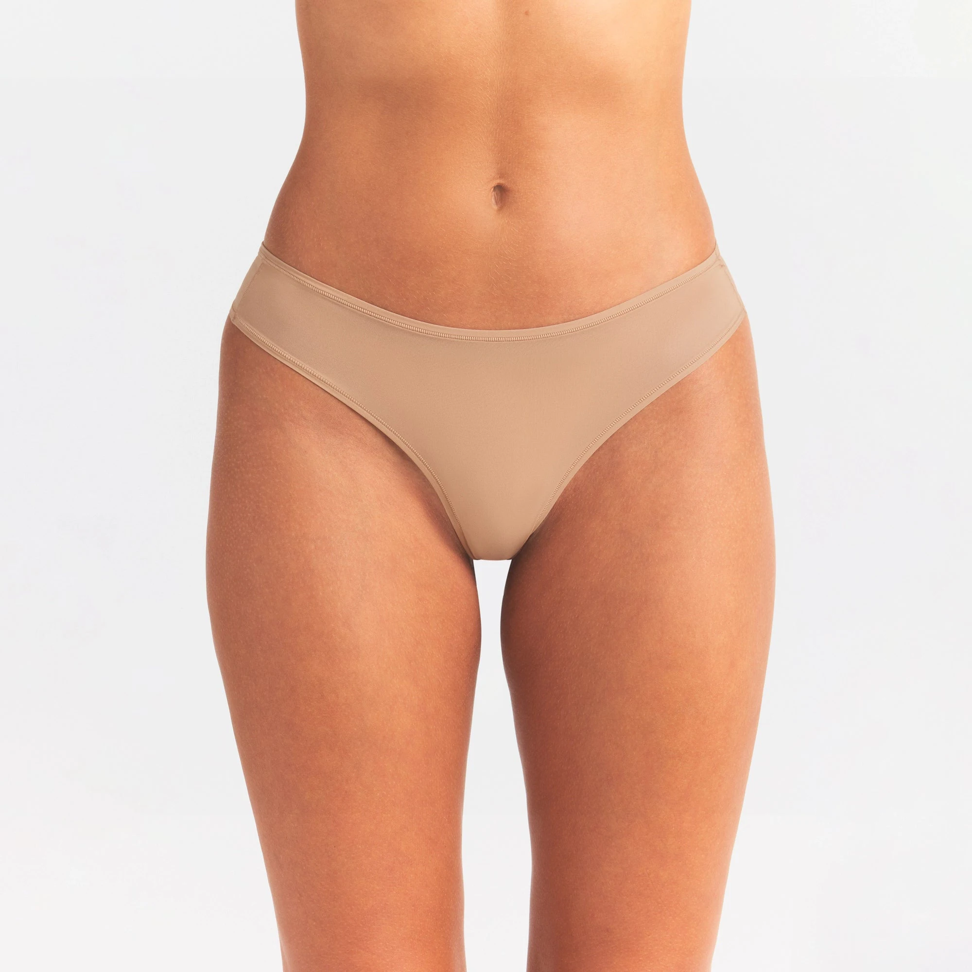 FITS EVERYBODY THONG | OCHRE ON A MODEL SIDE VIEW @ | FOCUS: 0.0, 1.0, 0.9