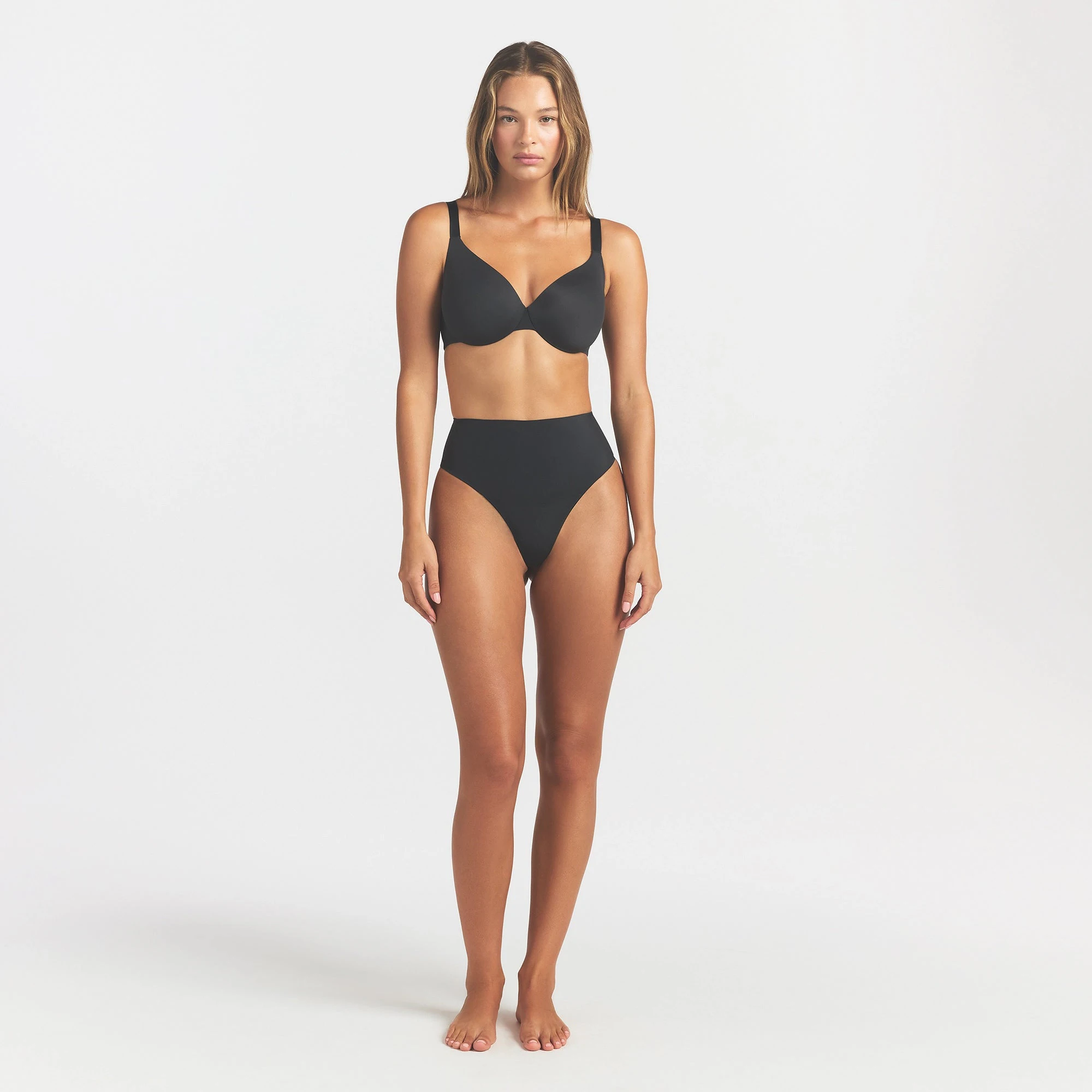 SMOOTHING INTIMATES HIGH-WAISTED THONG | ONYX ON A MODEL FRONT VIEW @ | FOCUS: 0.0, 1.0, 0.9