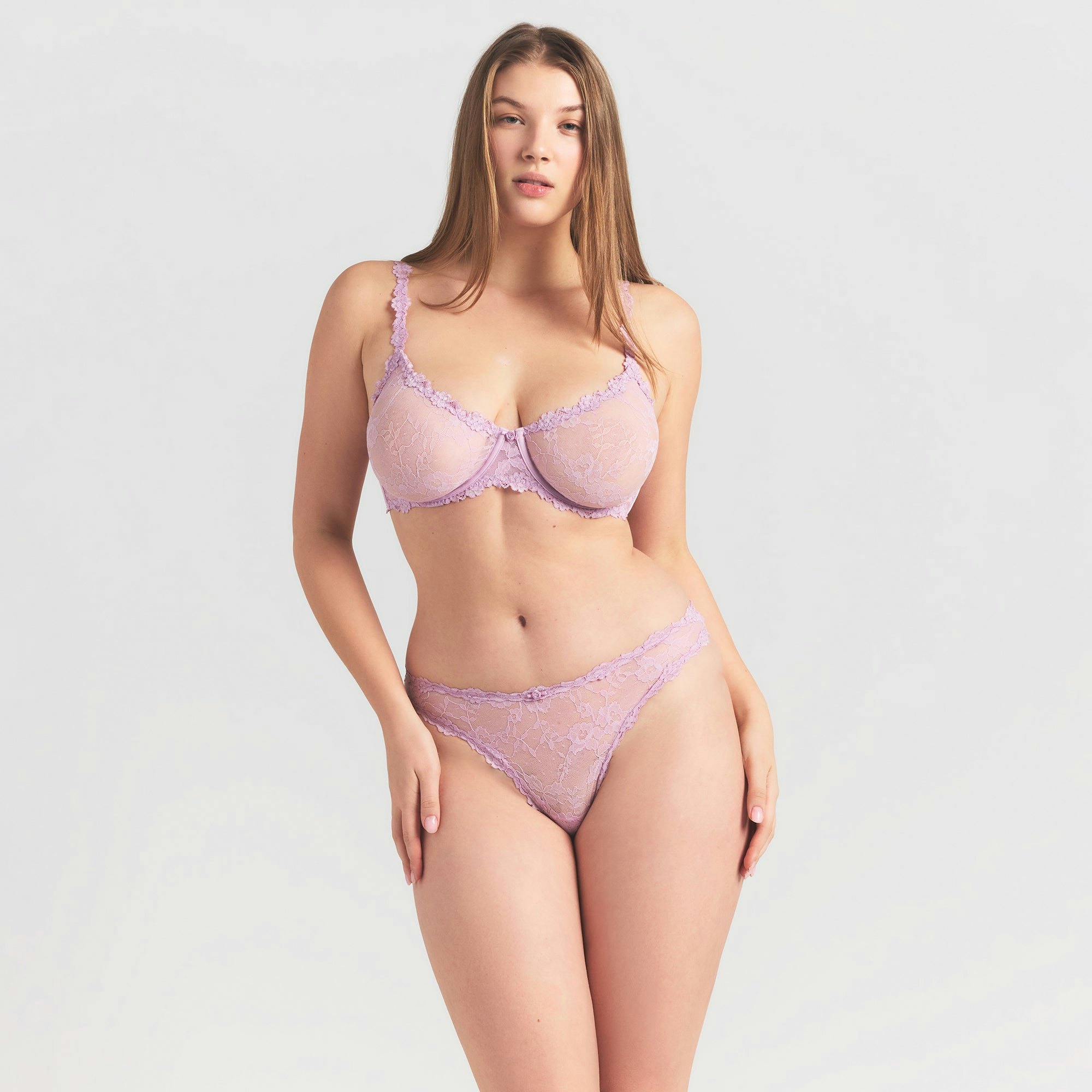 STRETCH LACE DIPPED THONG | BABY PINK ON A MODEL SIDE VIEW @ | FOCUS: 0.0, 1.0, 0.9