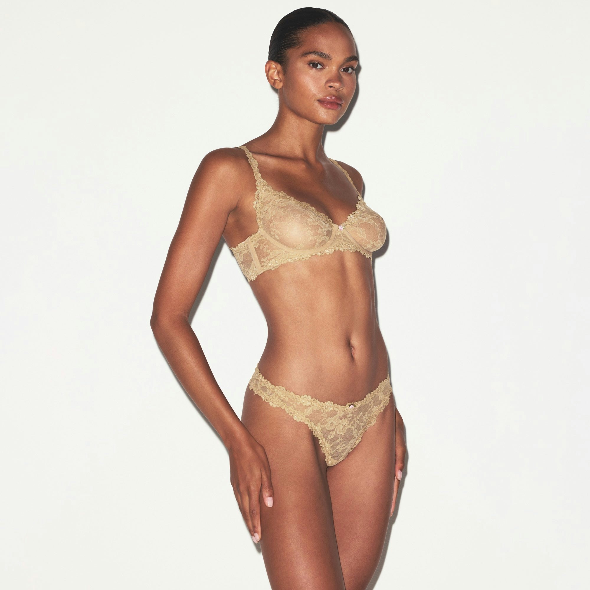 STRETCH LACE DIPPED THONG | DELTA ON A MODEL SIDE VIEW @ | FOCUS: 0.0, 1.0, 0.9