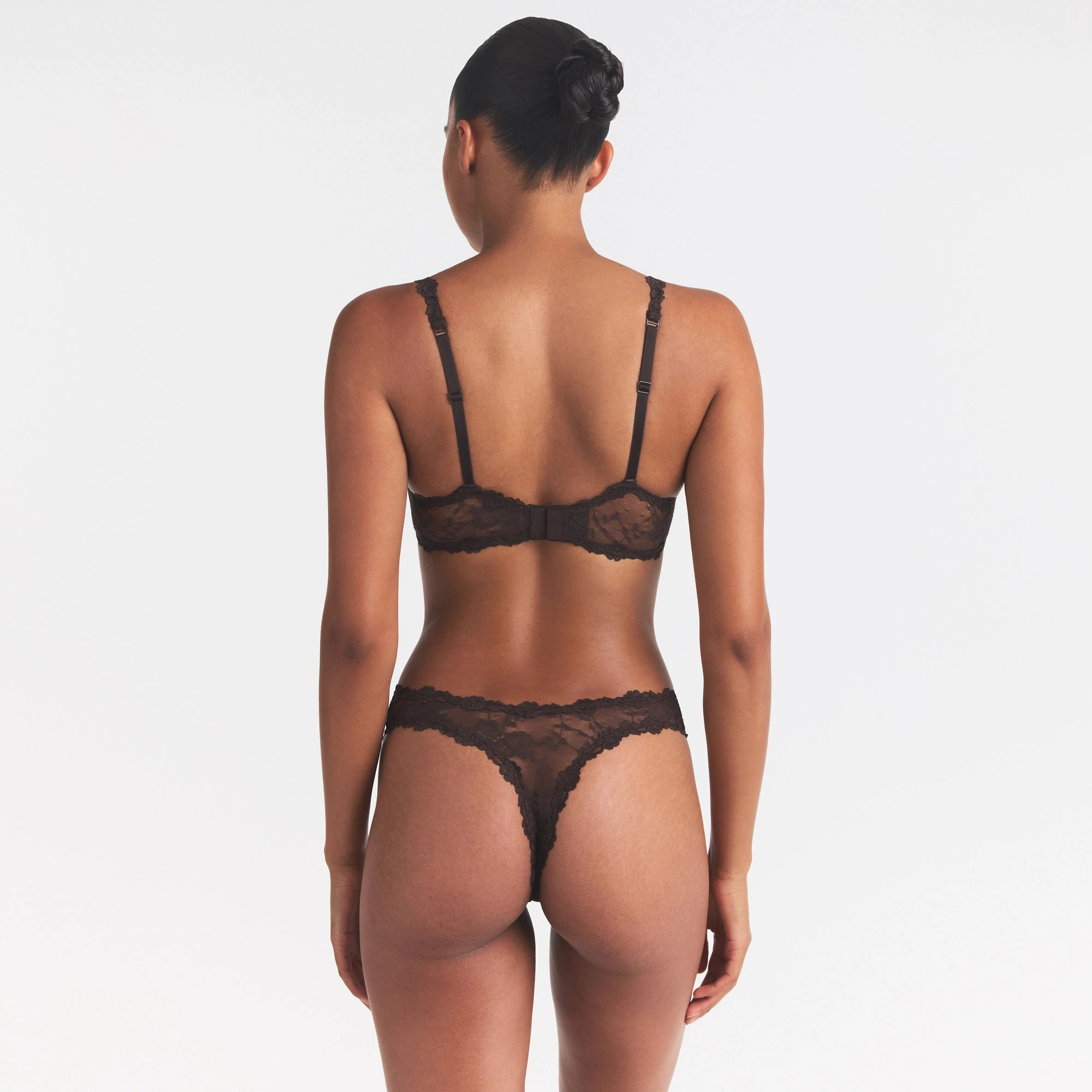 STRETCH LACE DIPPED THONG | ESPRESSO ON A MODEL SIDE VIEW @ | FOCUS: 0.0, 1.0, 0.9
