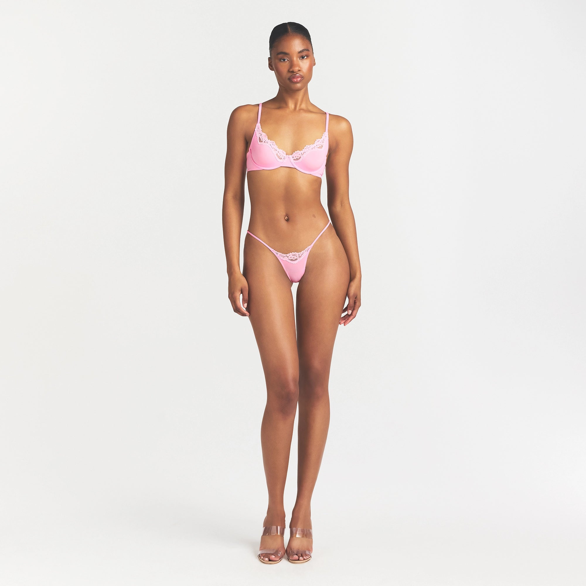 FITS EVERYBODY LACE STRING THONG | BUBBLE GUM TONAL ON A MODEL FRONT VIEW @ | FOCUS: 0.0, 1.0, 0.9