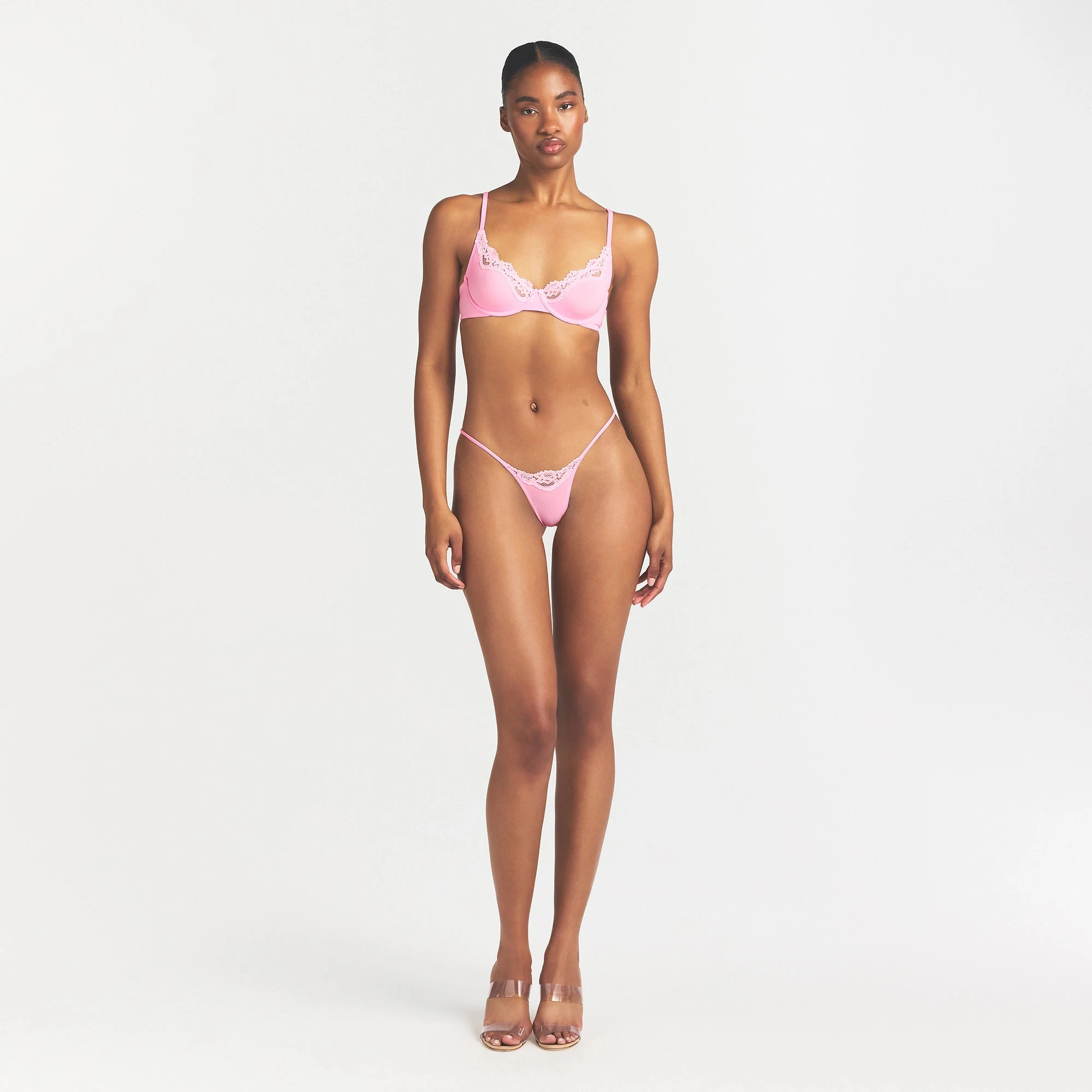 FITS EVERYBODY LACE STRING THONG | BUBBLE GUM TONAL ON A MODEL FRONT VIEW
