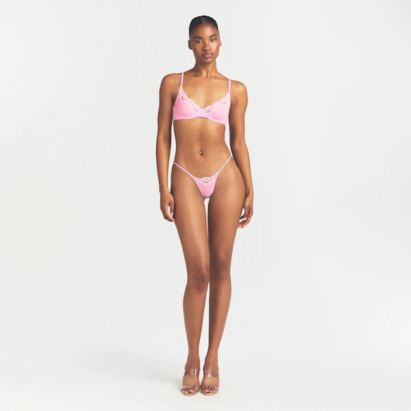 FITS EVERYBODY LACE STRING THONG | BUBBLE GUM TONAL ON A MODEL FRONT VIEW