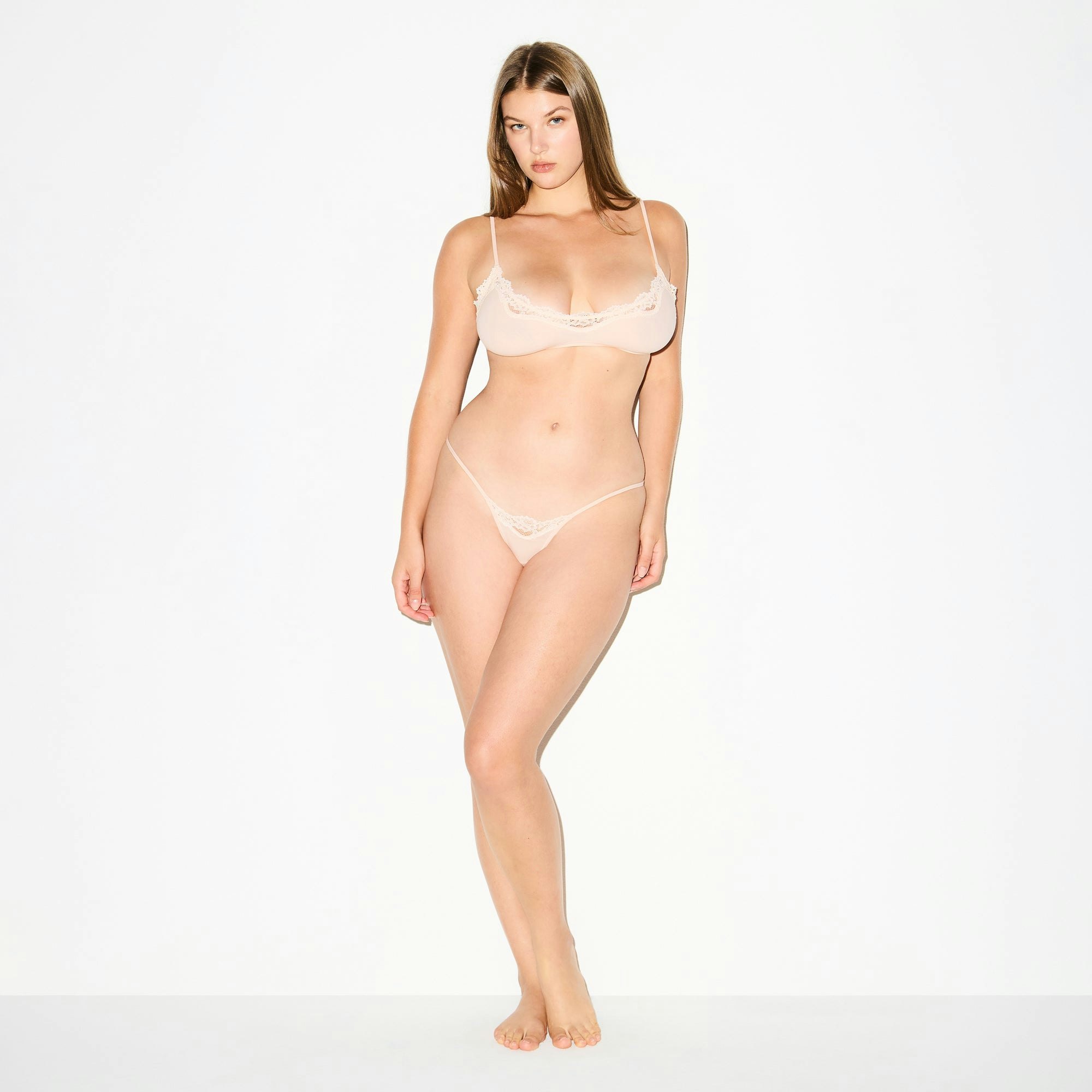 FITS EVERYBODY LACE STRING THONG | PRIMROSE ON A MODEL FRONT VIEW @ | FOCUS: 0.0, 1.0, 0.9