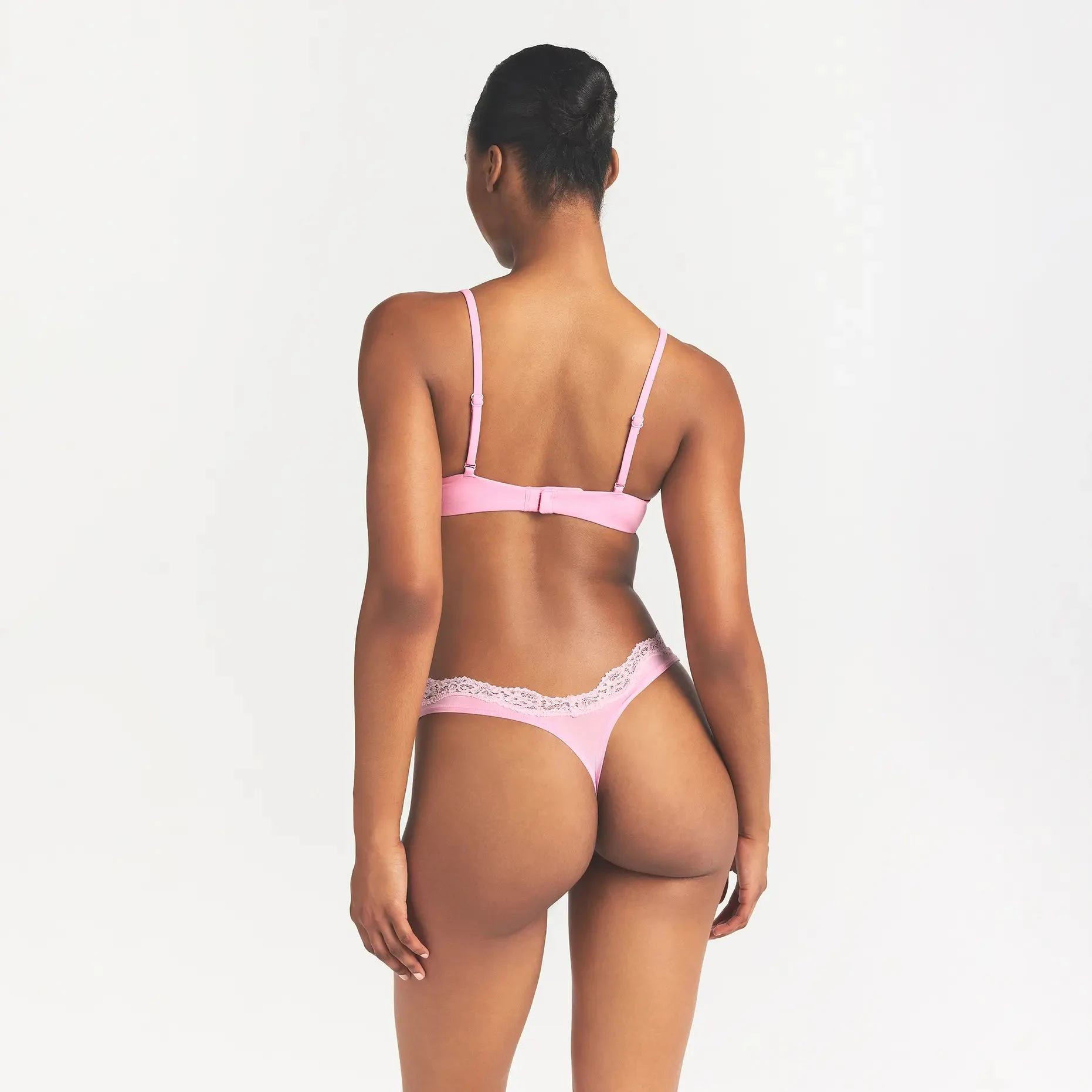 FITS EVERYBODY LACE DIPPED THONG | BUBBLE GUM TONAL ON A MODEL BACK VIEW @ | FOCUS: 0.0, 1.0, 0.9