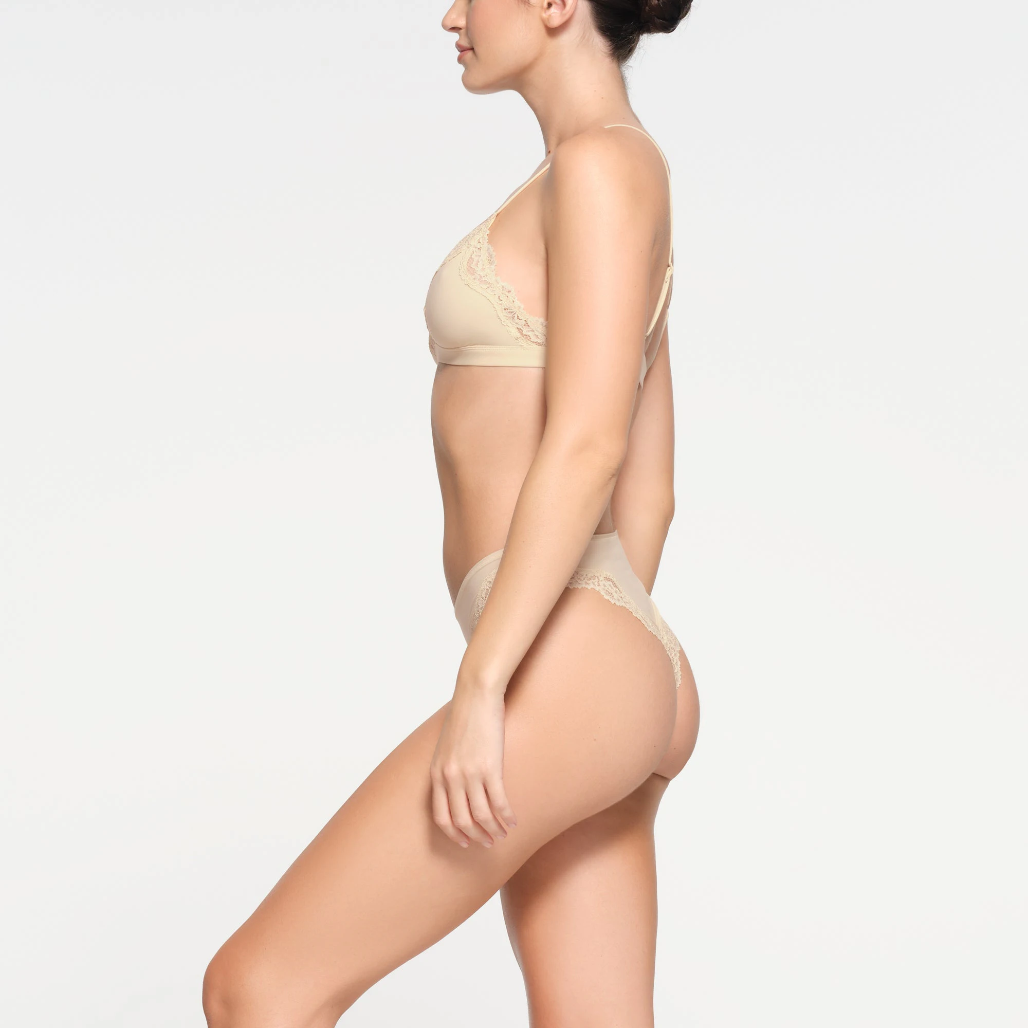 FITS EVERYBODY LACE TANGA | BUTTER ON A MODEL SIDE VIEW