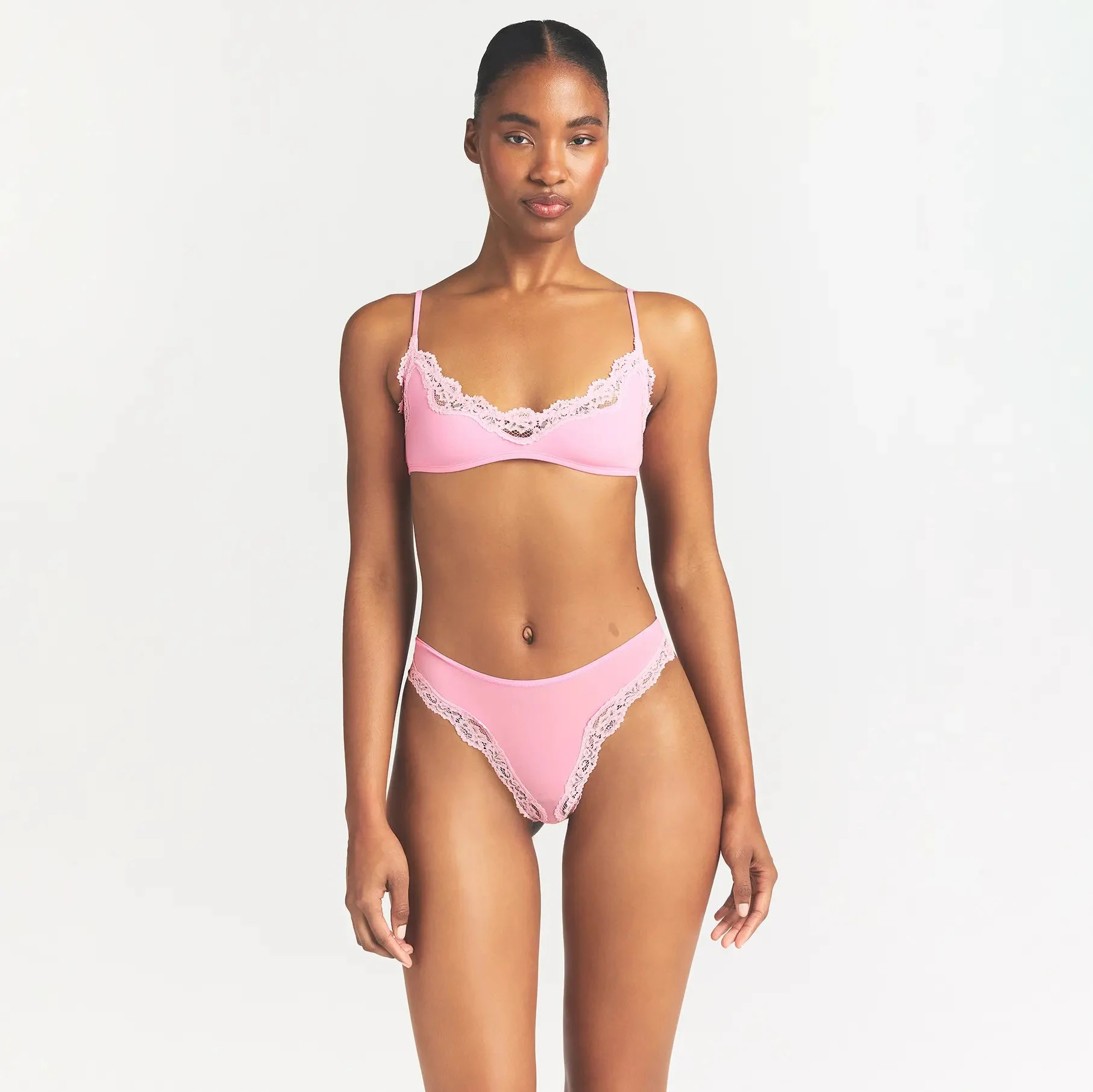 FITS EVERYBODY LACE TANGA | BUBBLE GUM TONAL ON A MODEL FRONT VIEW