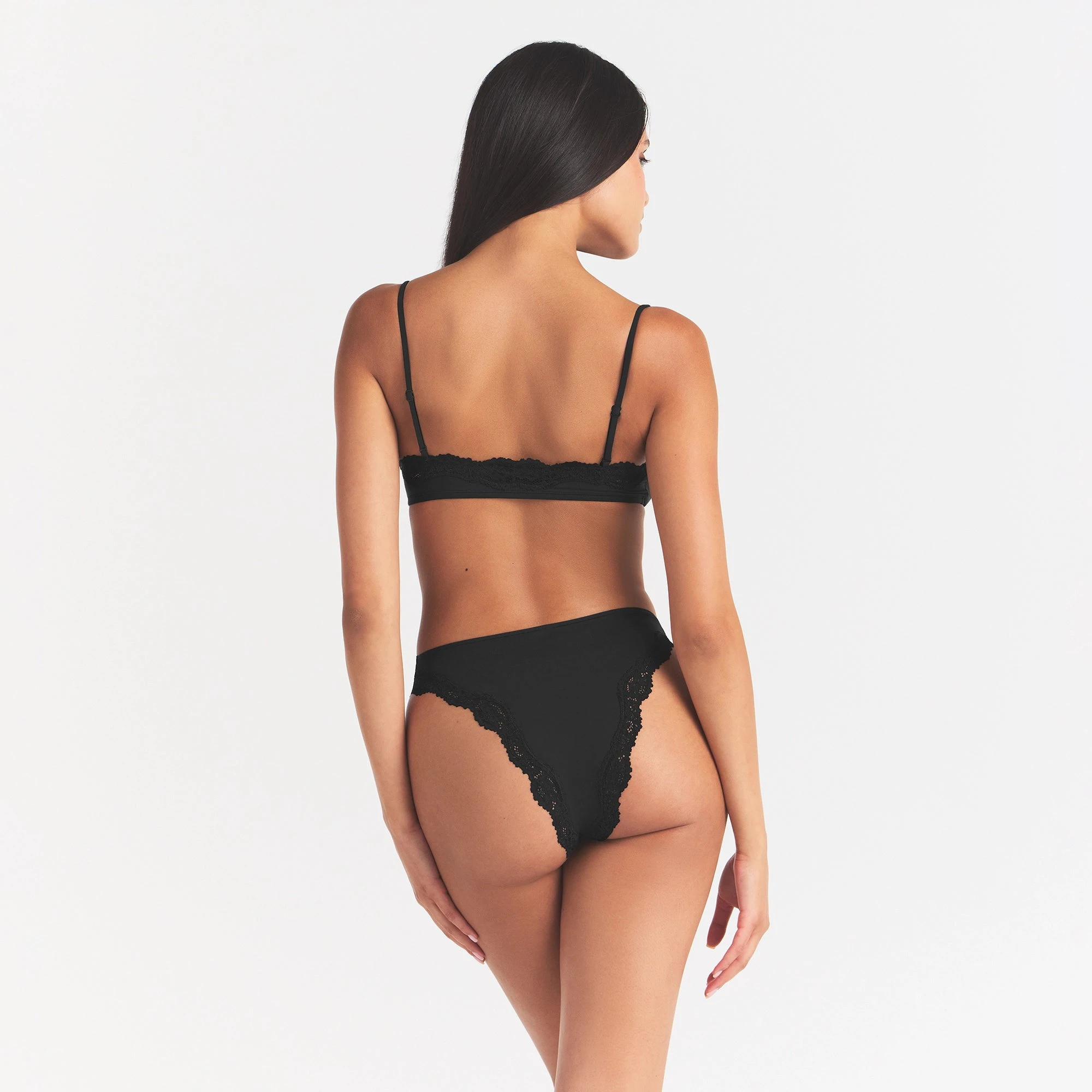 FITS EVERYBODY LACE TANGA | ONYX ON A MODEL BACK VIEW
