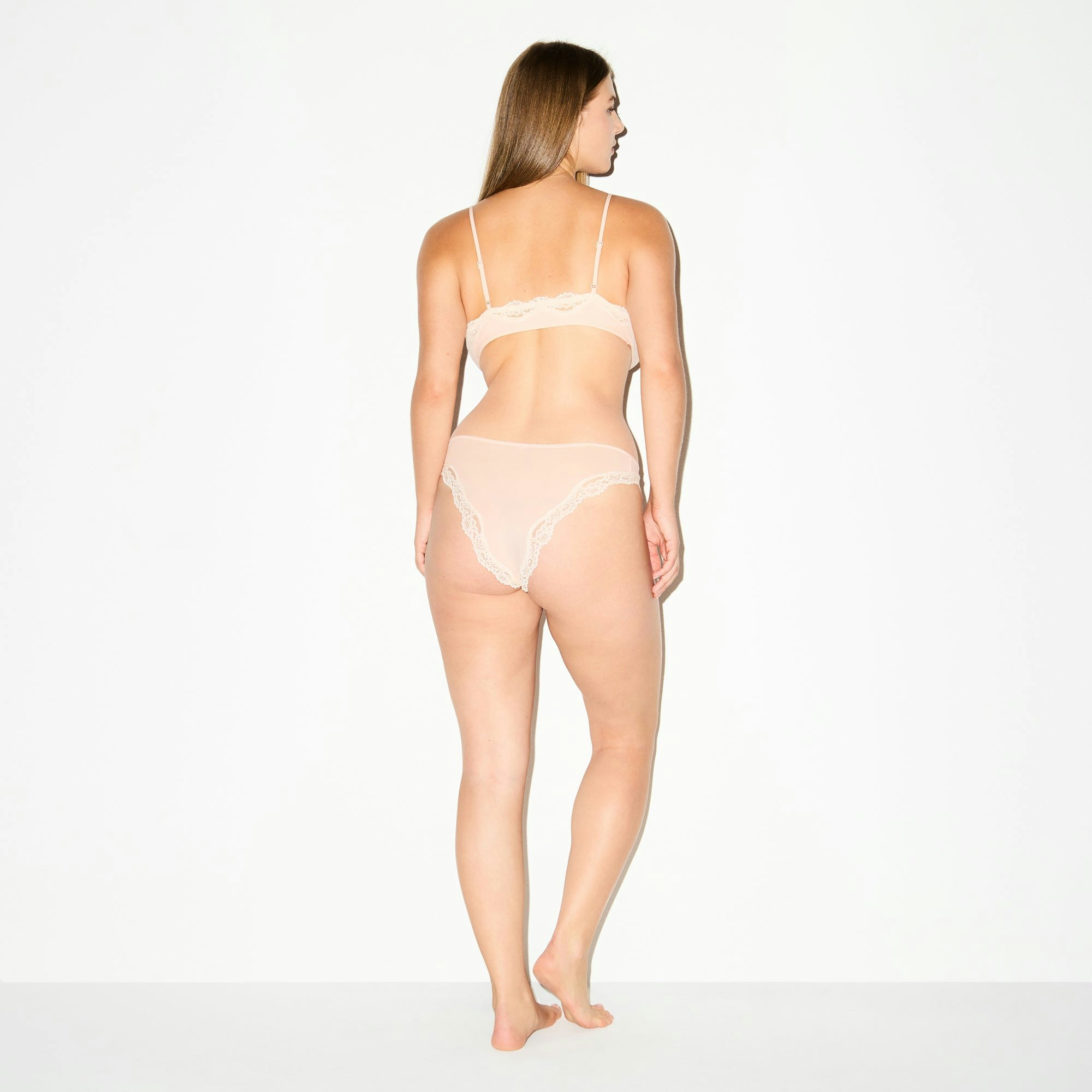 FITS EVERYBODY LACE TANGA | PRIMROSE ON A MODEL FRONT VIEW @ | FOCUS: 0.0, 1.0, 0.9