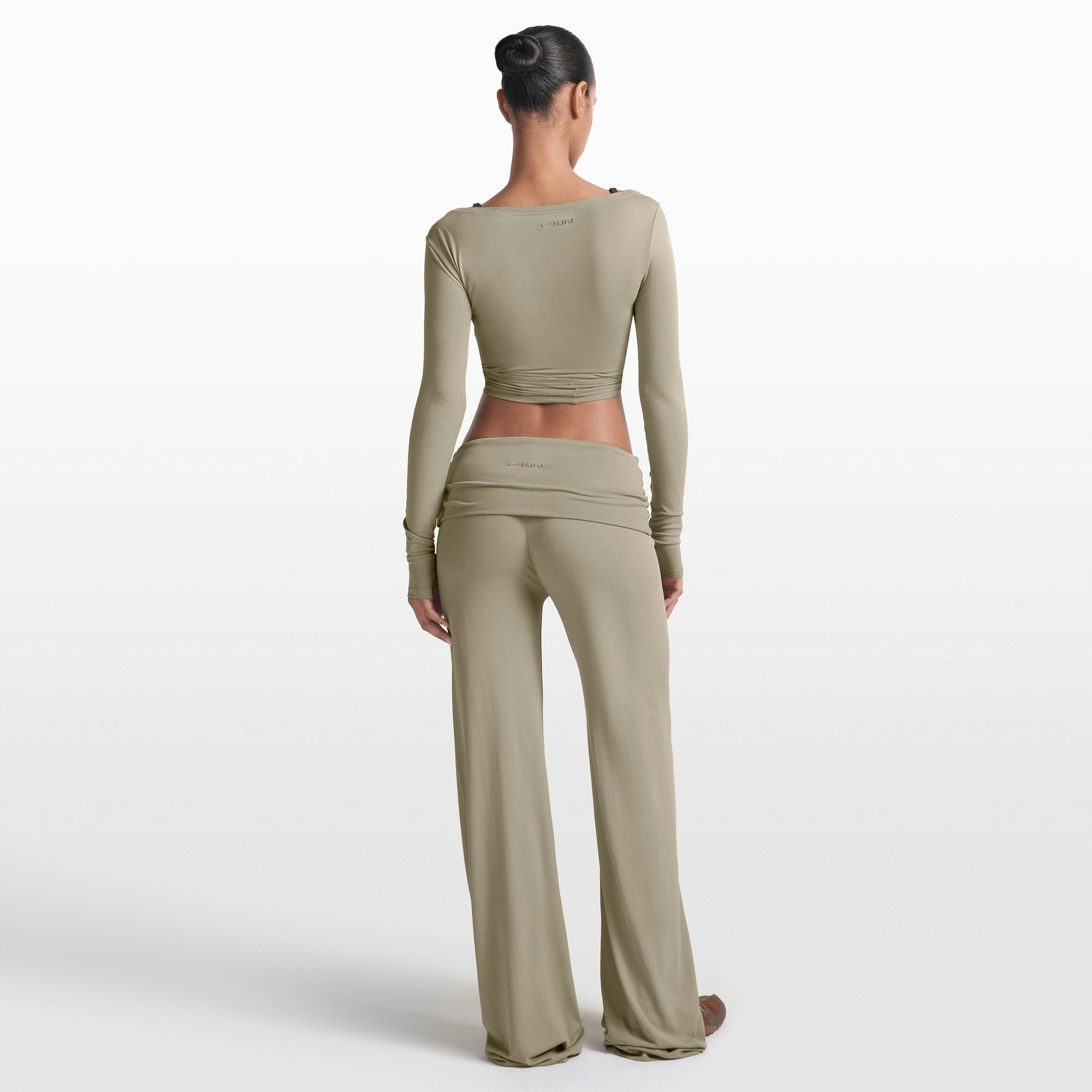 NikeSKIMS STRETCH KNIT FOLDOVER WIDE LEG PANT | DUNE ON A MODEL FRONT VIEW @ | FOCUS: 0.0, 1.0, 0.9