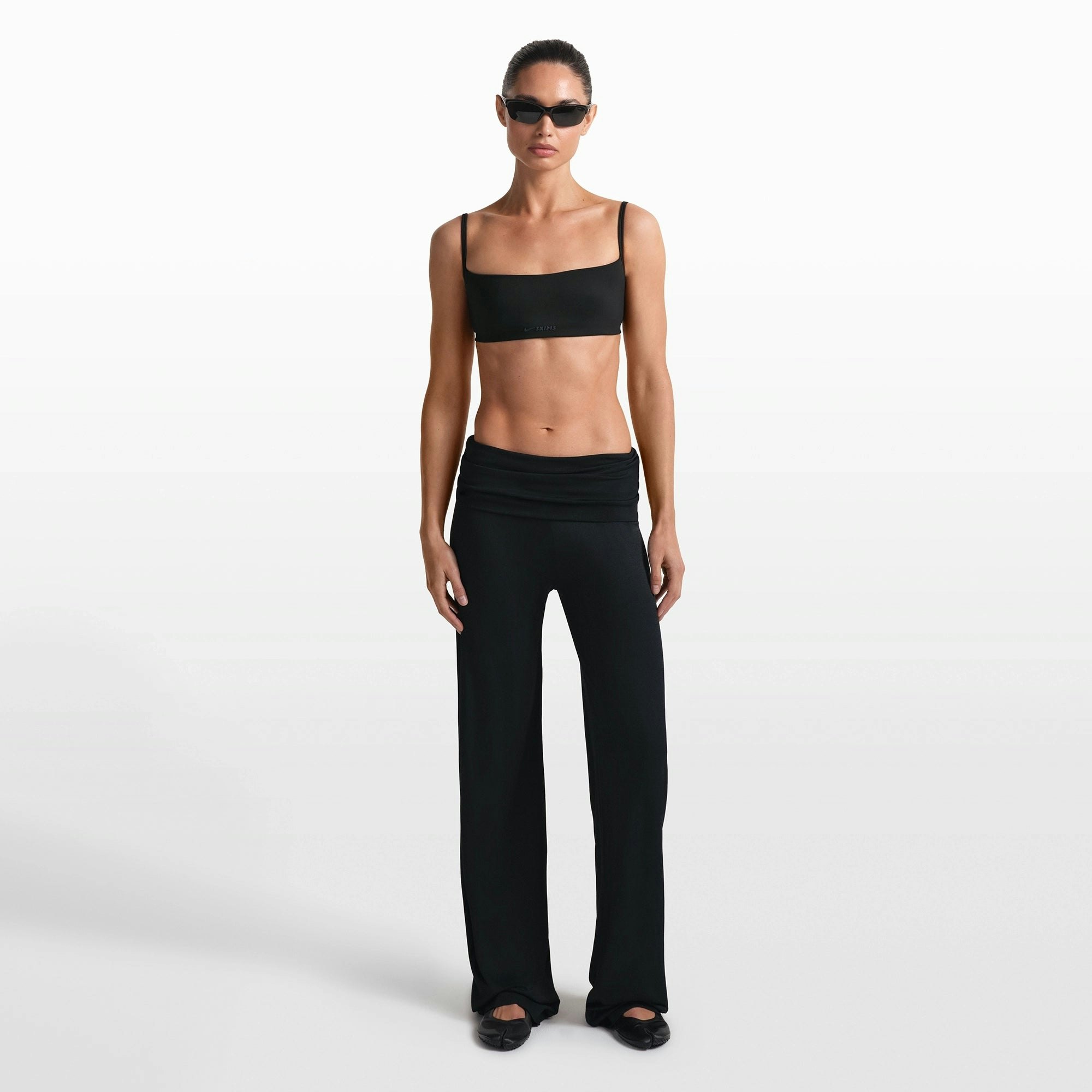 NikeSKIMS STRETCH KNIT FOLDOVER WIDE LEG PANT | OBSIDIAN ON A MODEL FRONT VIEW @ | FOCUS: 0.0, 1.0, 0.9