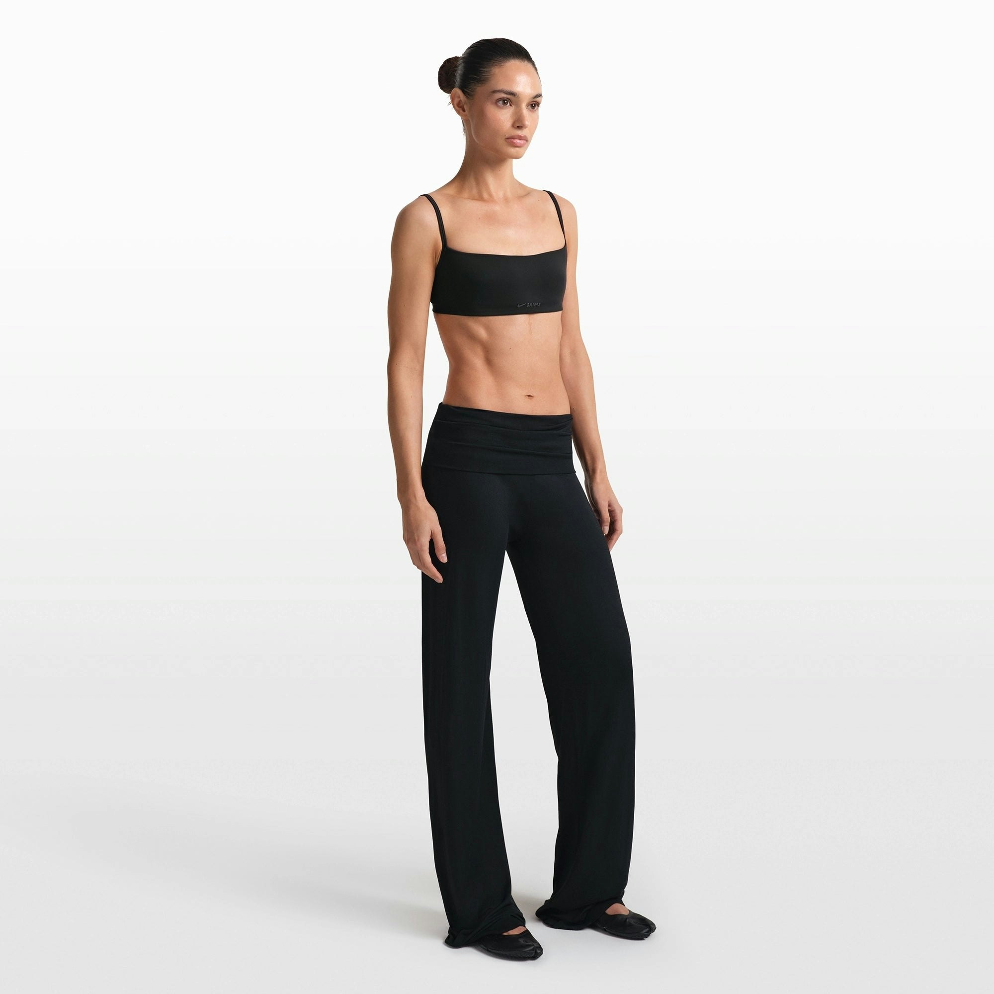 NikeSKIMS STRETCH KNIT FOLDOVER WIDE LEG PANT | OBSIDIAN ON A MODEL FRONT VIEW @ | FOCUS: 0.0, 1.0, 0.9