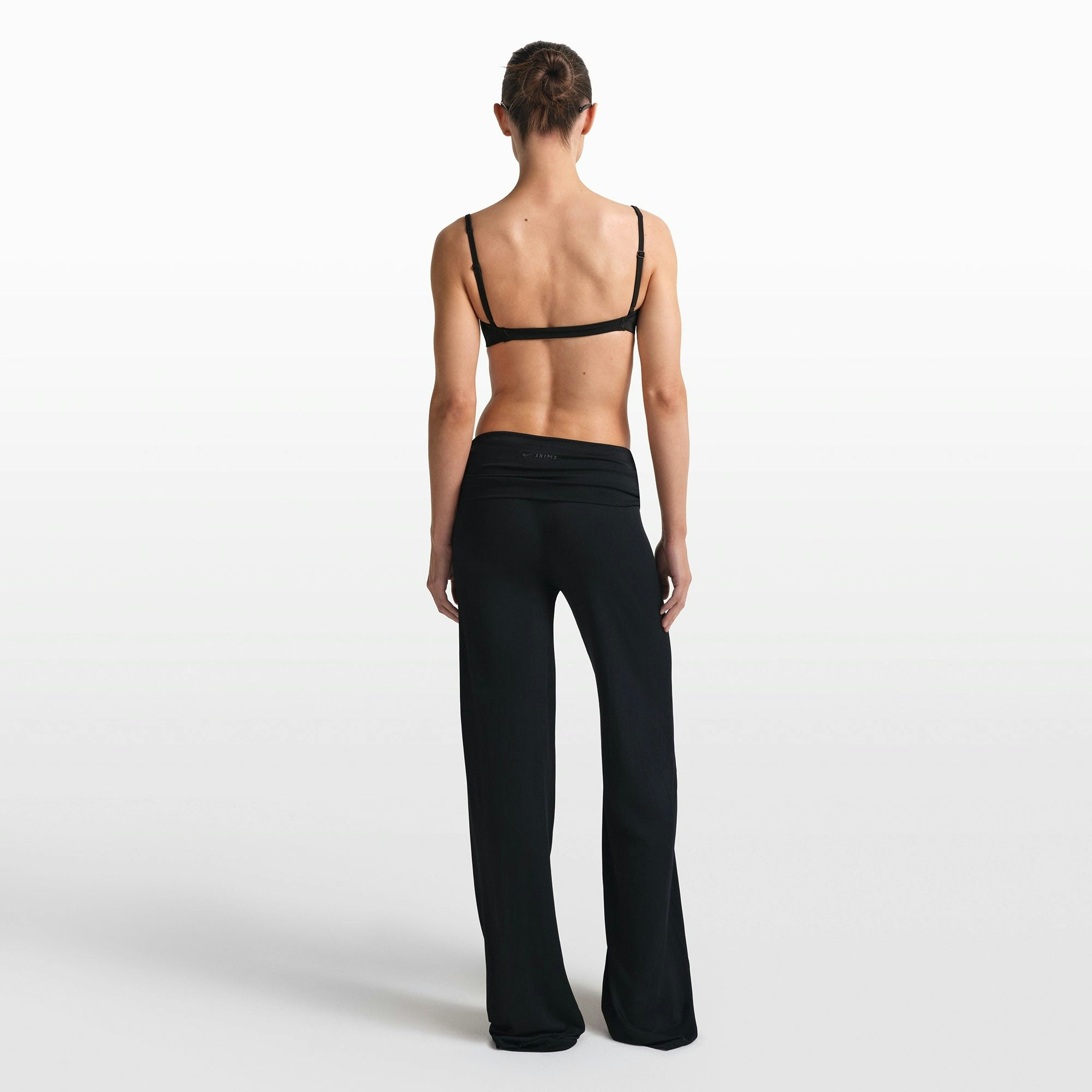 NikeSKIMS STRETCH KNIT FOLDOVER WIDE LEG PANT | OBSIDIAN ON A MODEL FRONT VIEW @ | FOCUS: 0.0, 1.0, 0.9