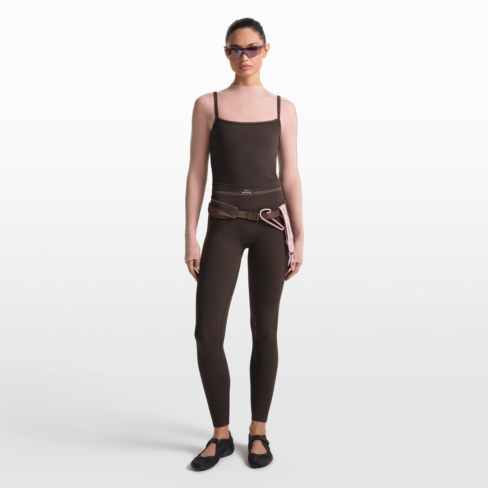 NikeSKIMS RIBBED SEAMLESS 26" LEGGING | PHOENIX/TRUFFLE ON A MODEL FRONT VIEW @ | FOCUS: 0.0, 1.0, 0.9