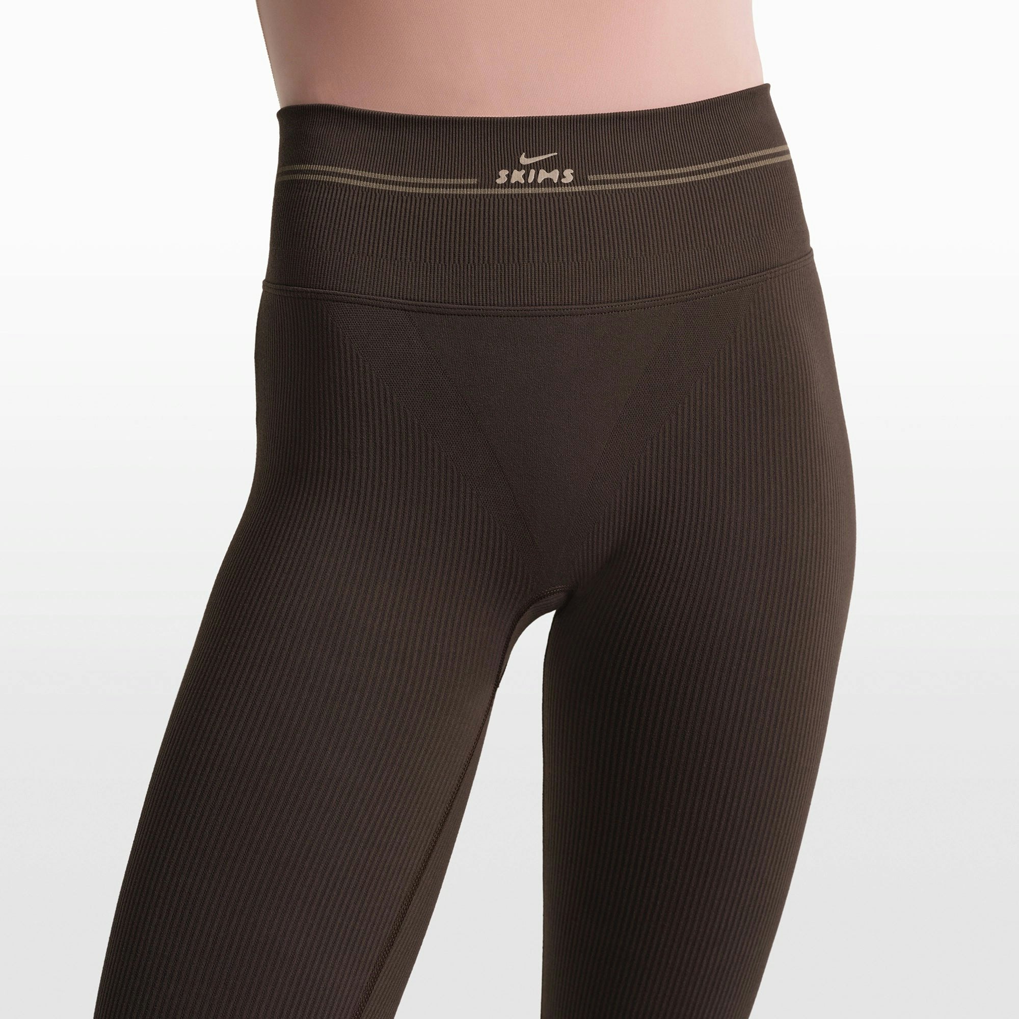 NikeSKIMS RIBBED SEAMLESS 26" LEGGING | PHOENIX/TRUFFLE ON A MODEL FRONT VIEW @ | FOCUS: 0.0, 1.0, 0.9