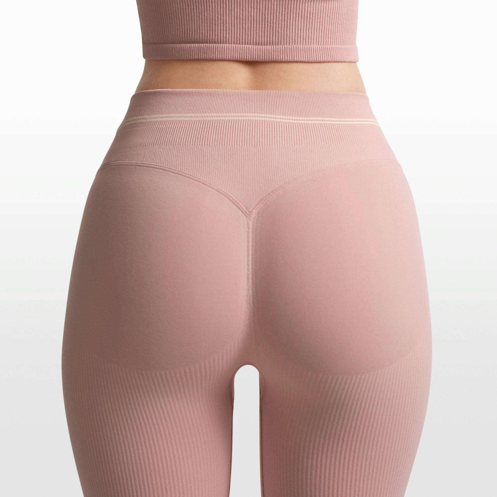 NikeSKIMS RIBBED SEAMLESS 34" STRAIGHT LEGGING | HIMALAYAN/ECRU ON A MODEL FRONT VIEW @ | FOCUS: 0.0, 1.0, 0.9