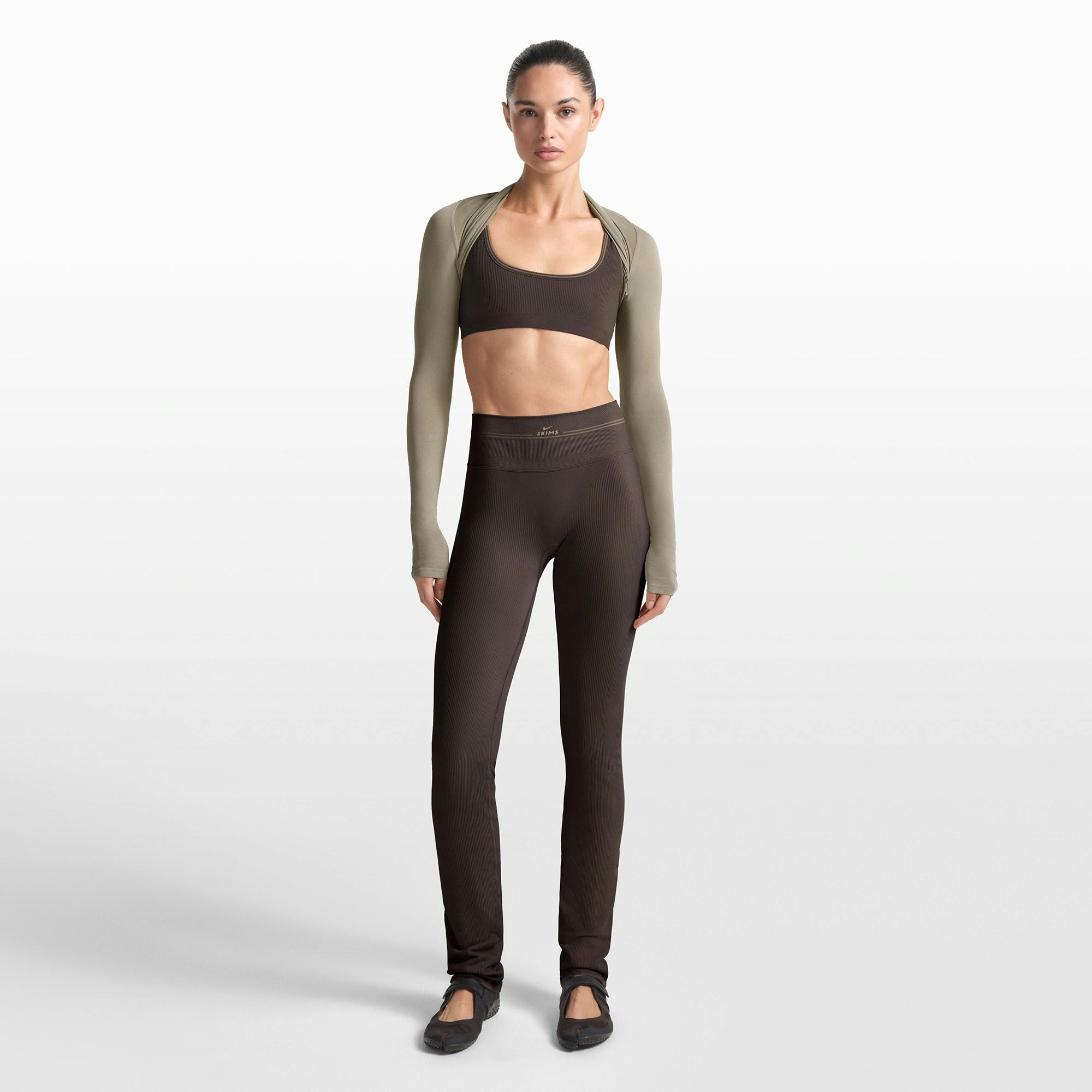 NikeSKIMS RIBBED SEAMLESS 34" STRAIGHT LEGGING | PHOENIX/TRUFFLE ON A MODEL FRONT VIEW @ | FOCUS: 0.0, 1.0, 0.9
