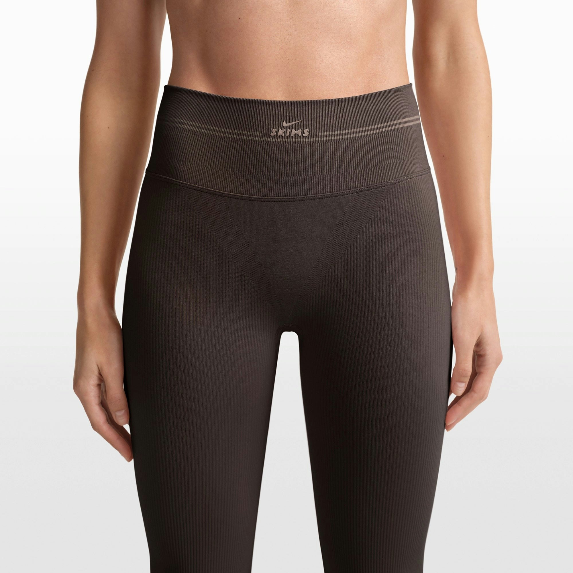 NikeSKIMS RIBBED SEAMLESS 34" STRAIGHT LEGGING | PHOENIX/TRUFFLE ON A MODEL FRONT VIEW @ | FOCUS: 0.0, 1.0, 0.9