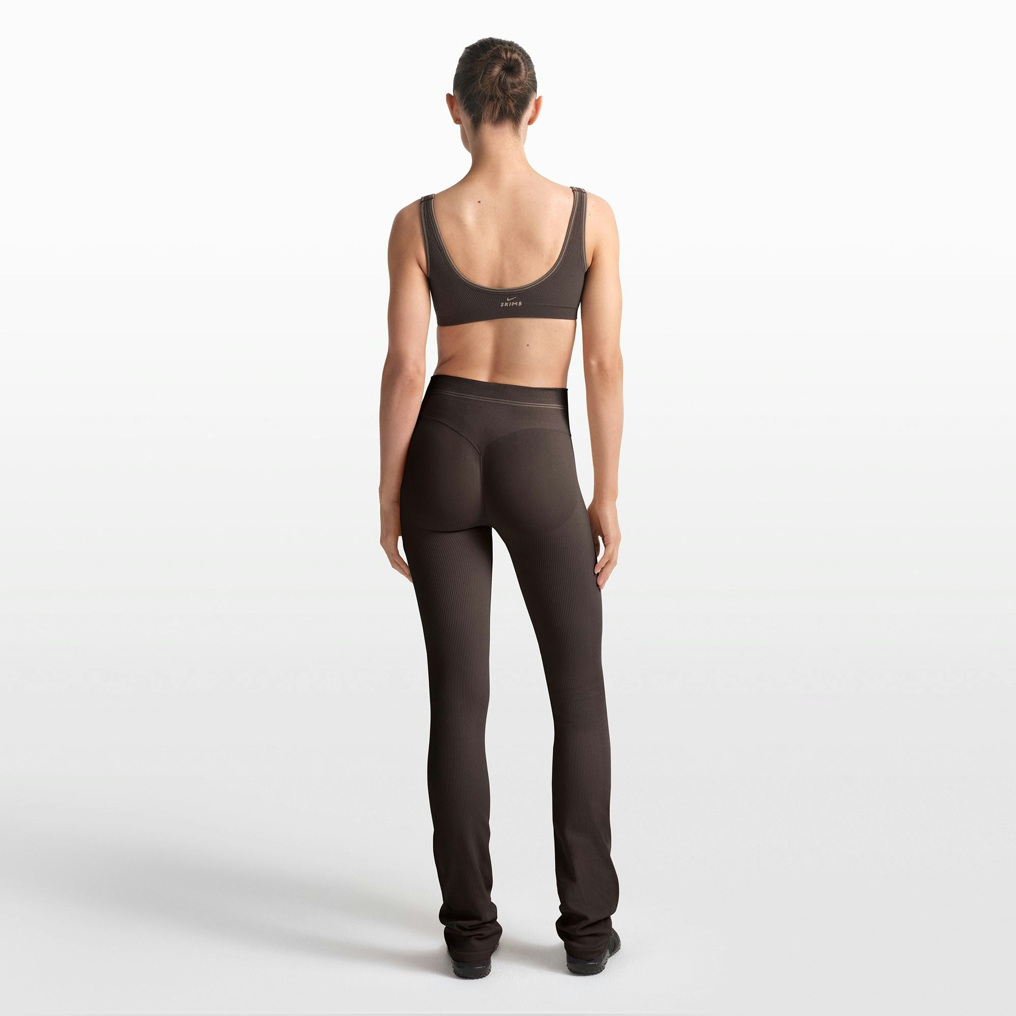 NikeSKIMS RIBBED SEAMLESS 34" STRAIGHT LEGGING | PHOENIX/TRUFFLE ON A MODEL FRONT VIEW @ | FOCUS: 0.0, 1.0, 0.9