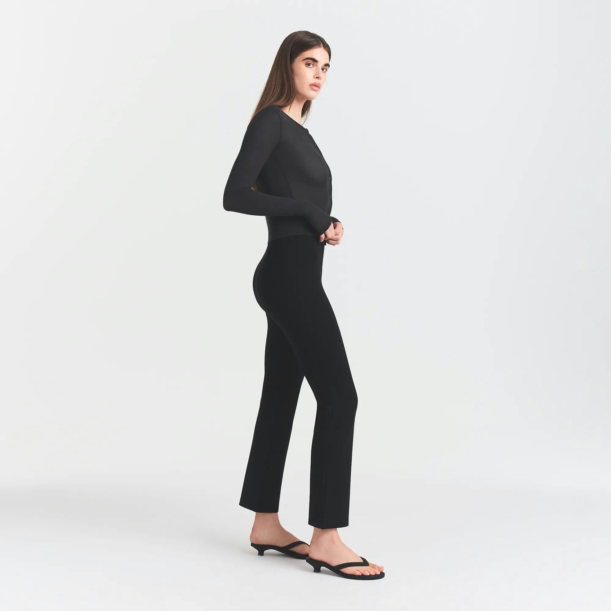 THE ESSENTIAL COLLECTION HIGH-WAISTED CROPPED KICK FLARE PANT | OBSIDIAN ON A MODEL SIDE VIEW @ | FOCUS: 0.0, 1.0, 0.9