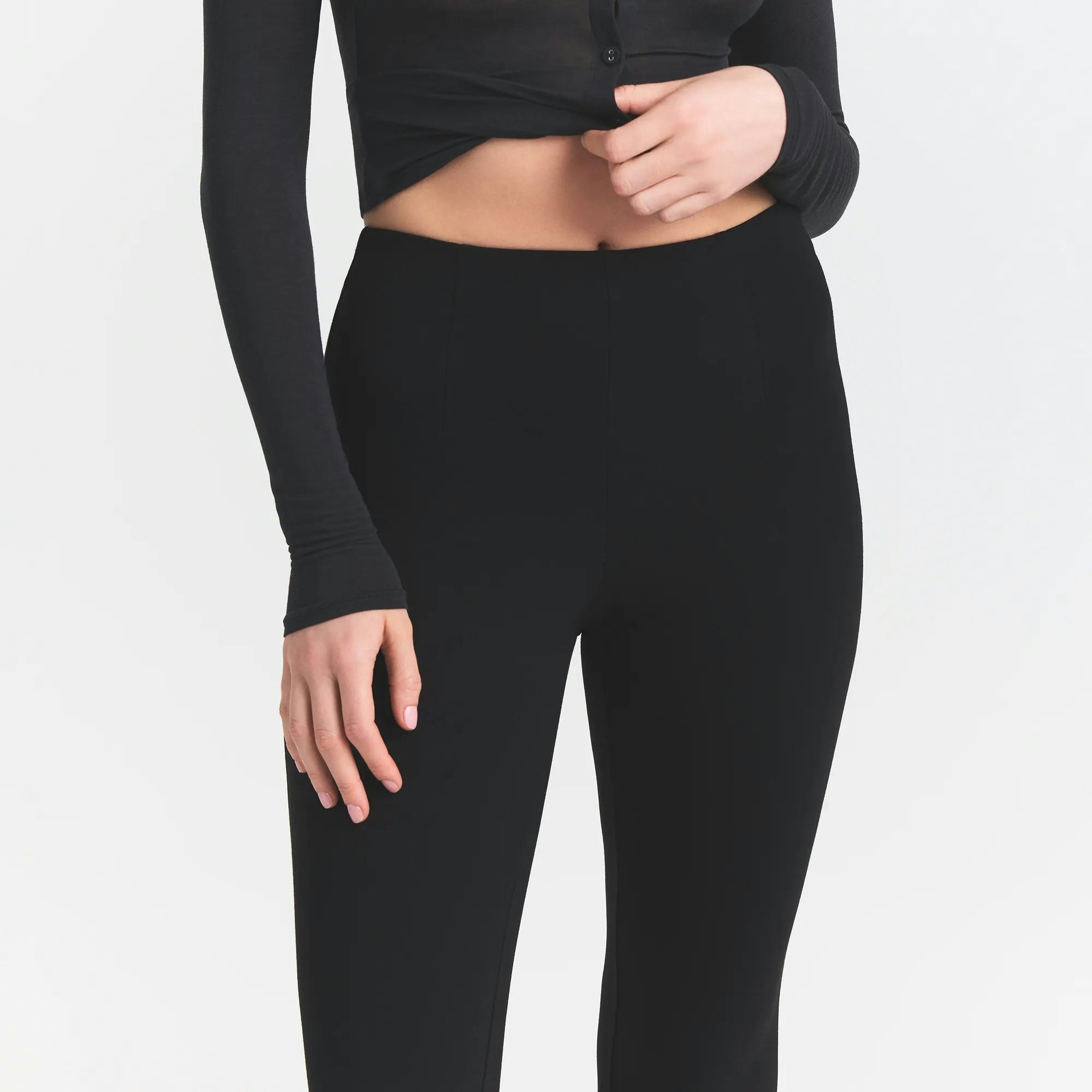 THE ESSENTIAL COLLECTION HIGH-WAISTED CROPPED KICK FLARE PANT | OBSIDIAN ON A MODEL FRONT VIEW @ | FOCUS: 0.0, 1.0, 0.9