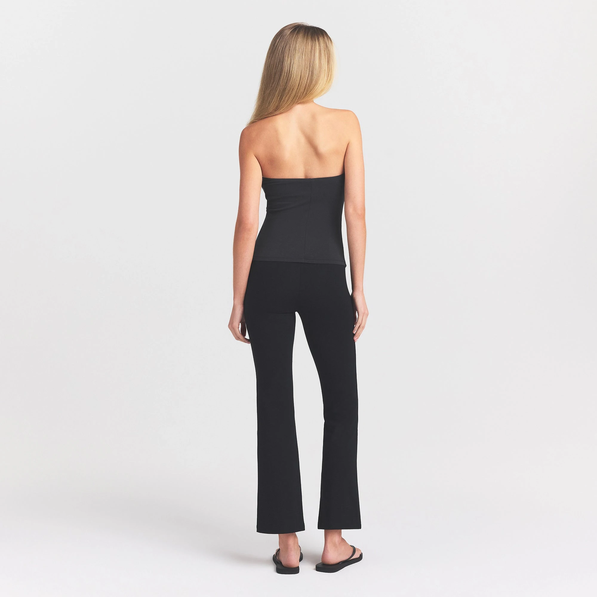 THE ESSENTIAL COLLECTION HIGH-WAISTED CROPPED KICK FLARE PANT | OBSIDIAN ON A MODEL BACK VIEW @ | FOCUS: 0.0, 1.0, 0.9