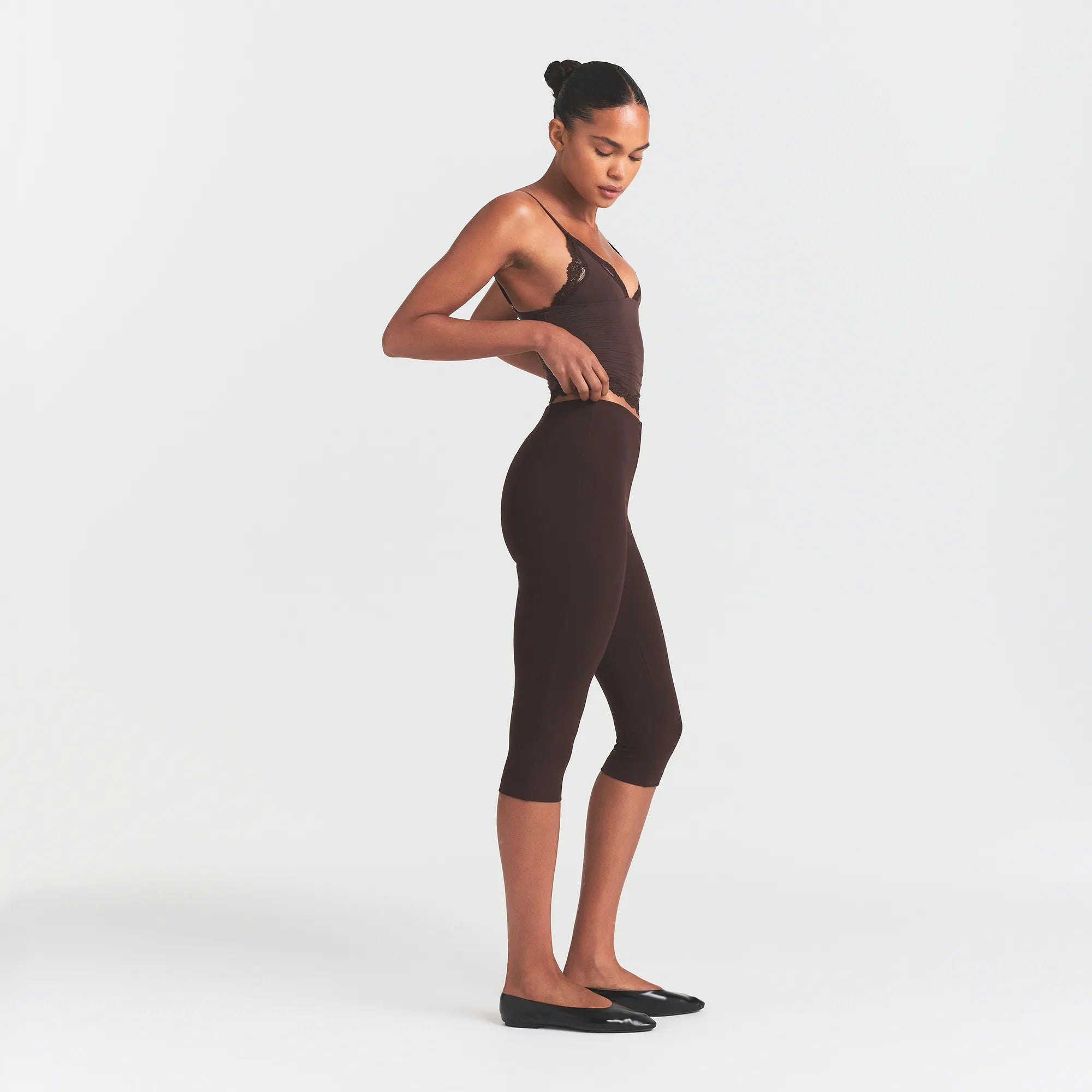 THE ESSENTIAL COLLECTION HIGH-WAISTED CAPRI | ESPRESSO ON A MODEL SIDE VIEW @ | FOCUS: 0.0, 1.0, 0.9
