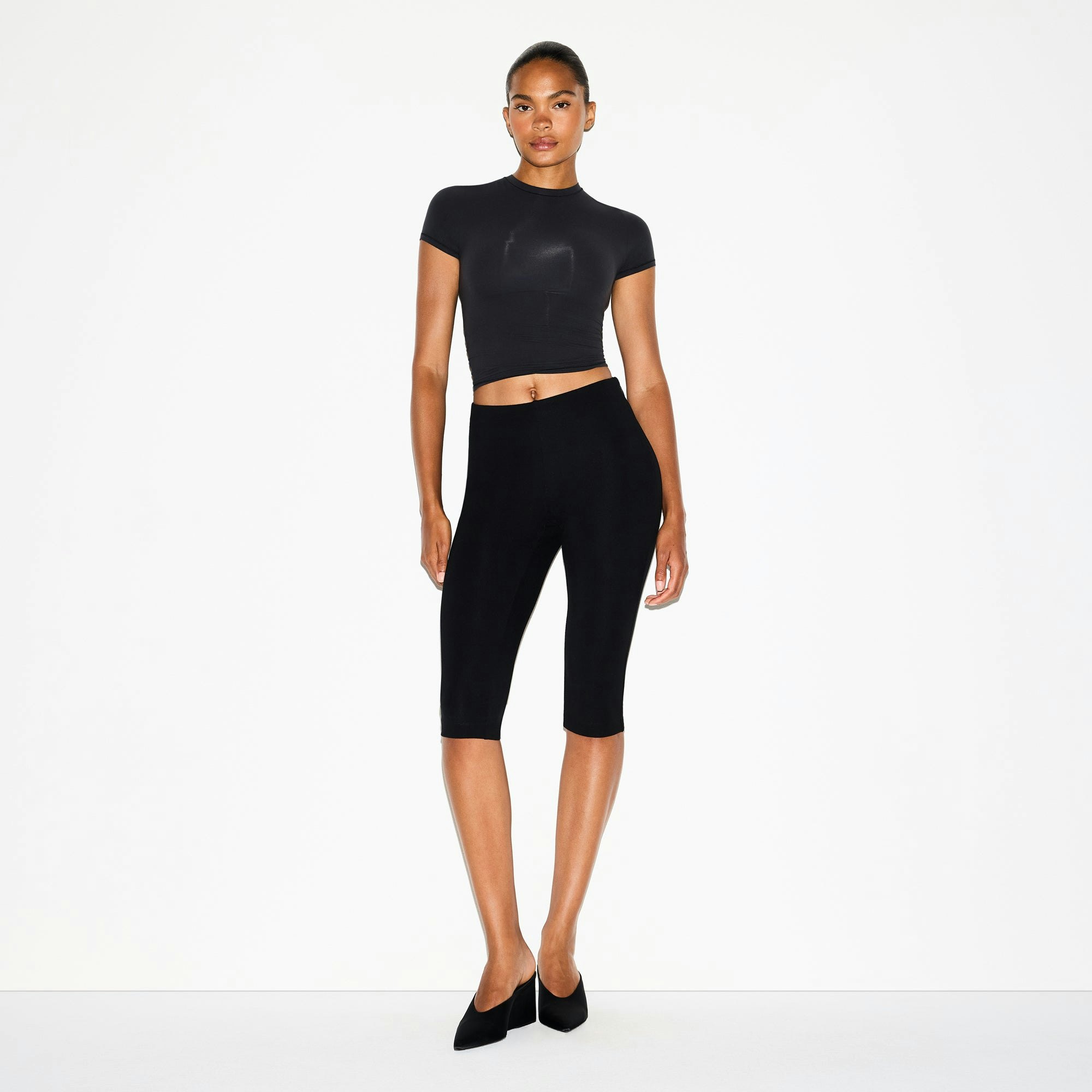 THE ESSENTIAL COLLECTION HIGH-WAISTED CAPRI | OBSIDIAN ON A MODEL FRONT VIEW @ | FOCUS: 0.0, 1.0, 0.9
