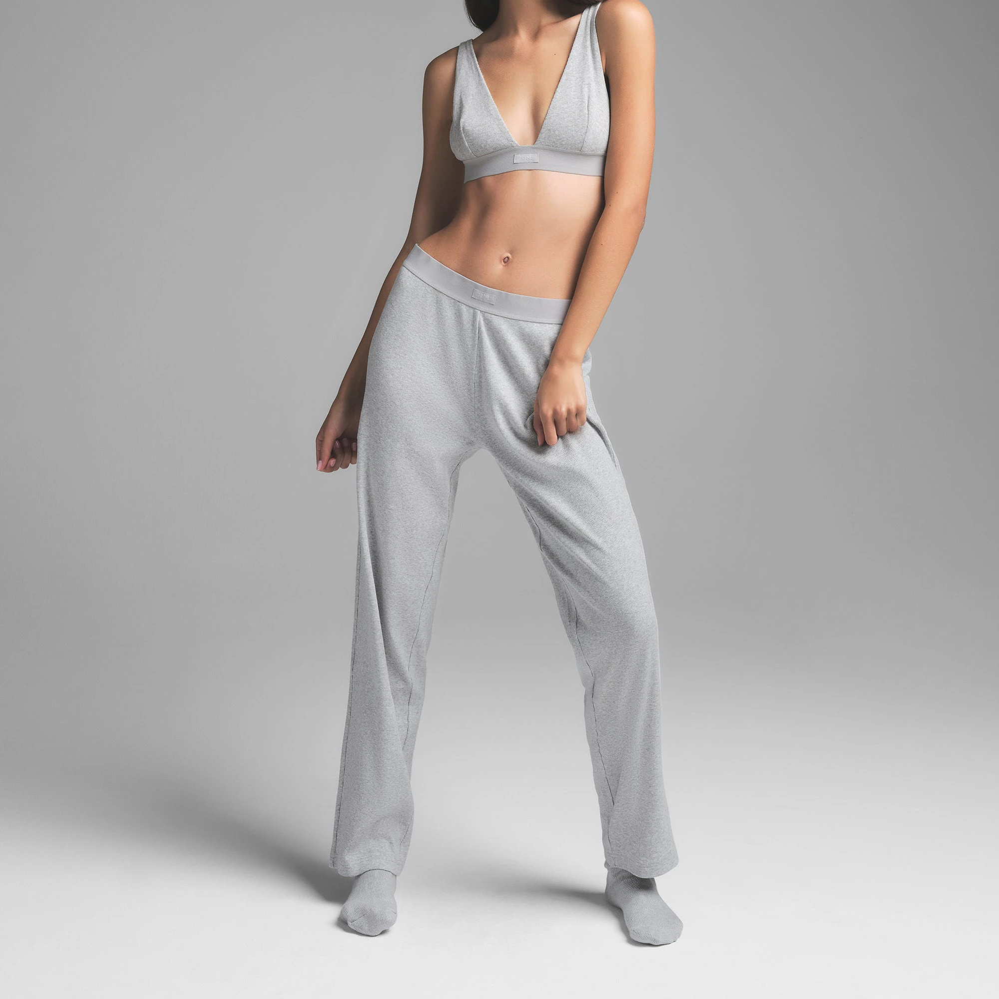 COTTON RIB PANT | LIGHT HEATHER GREY ON A MODEL SIDE VIEW