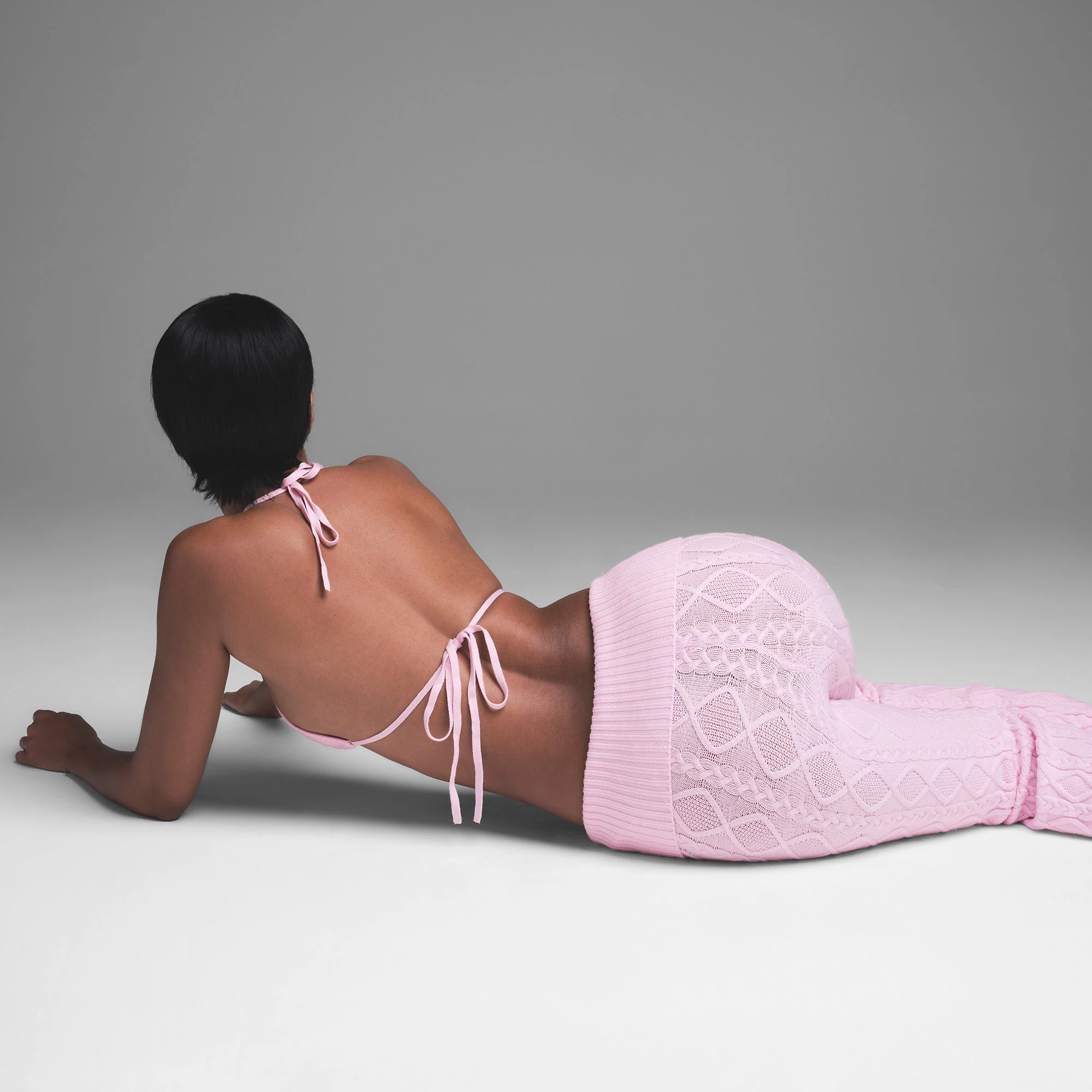 CABLE KNIT FOLDOVER PANT | BABY PINK ON A MODEL BACK VIEW | FOCUS: 0.0, 1.0, 0.9