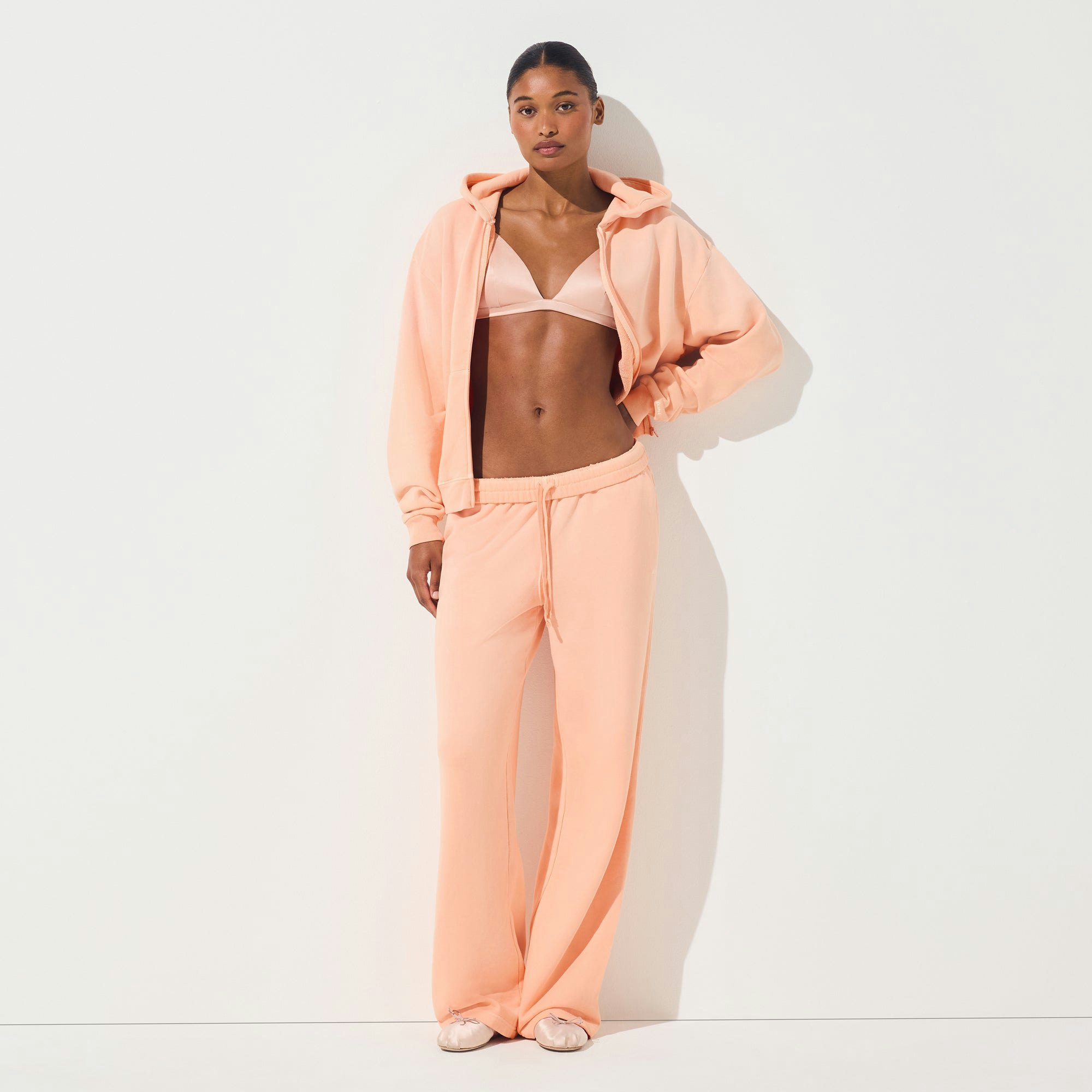 FRENCH TERRY LOW RISE STRAIGHT LEG PANT | CANTALOUPE ON A MODEL FRONT VIEW | FOCUS: 0.0, 1.0, 0.9