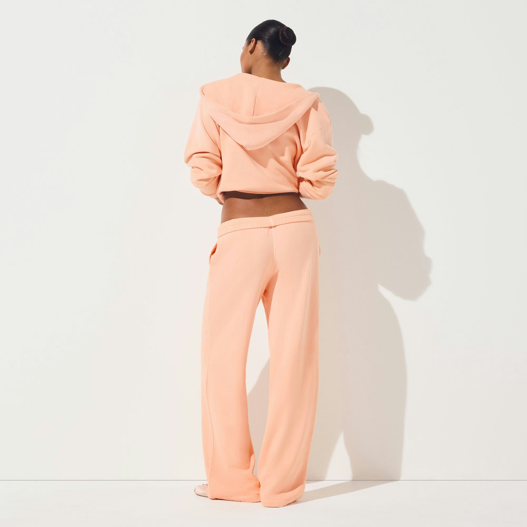FRENCH TERRY LOW RISE STRAIGHT LEG PANT | CANTALOUPE ON A MODEL FRONT VIEW | FOCUS: 0.0, 1.0, 0.9