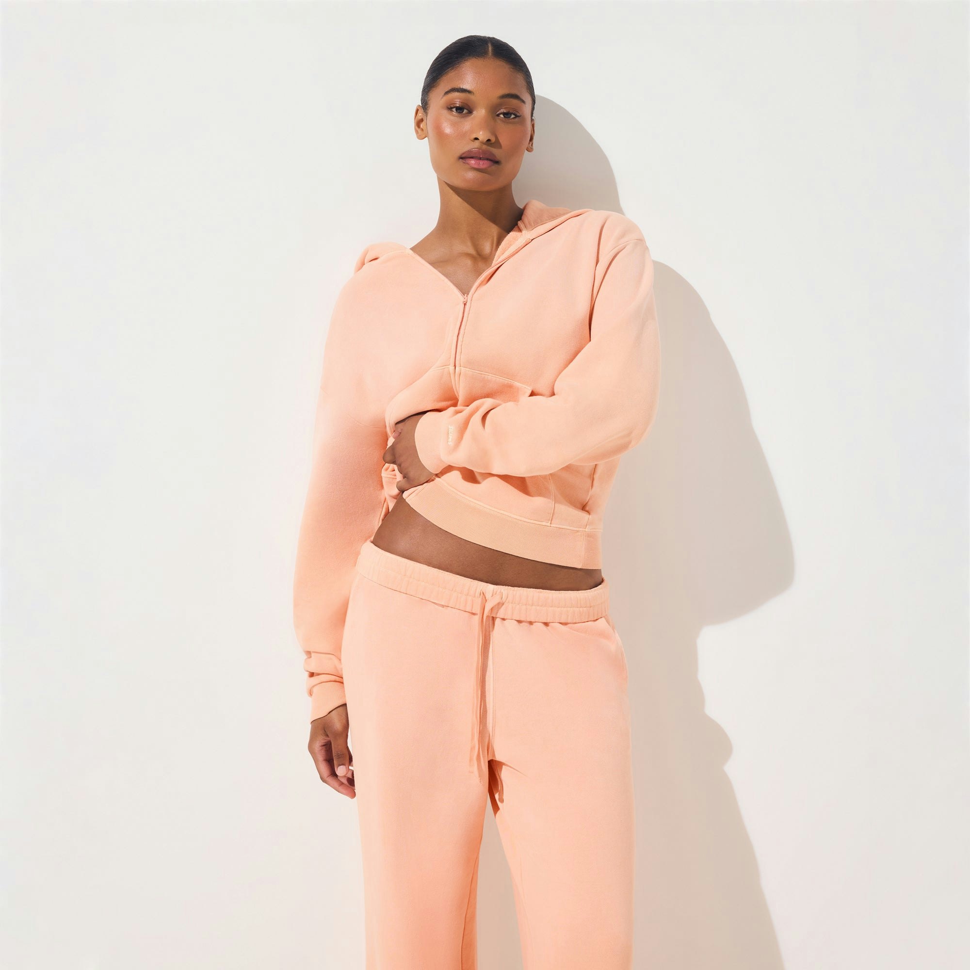 FRENCH TERRY LOW RISE STRAIGHT LEG PANT | CANTALOUPE ON A MODEL SIDE VIEW | FOCUS: 0.0, 1.0, 0.9